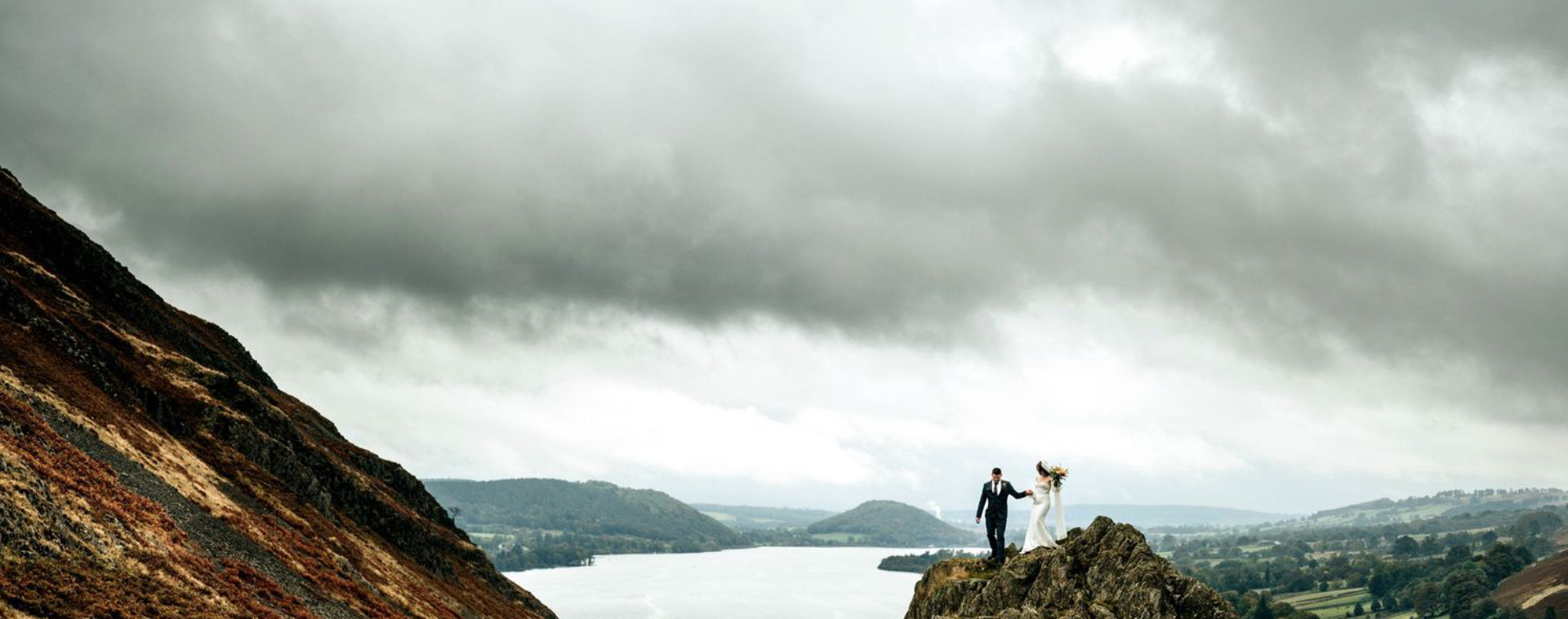 Wedding Photography - Bride & Groom on mountains in the Lake District