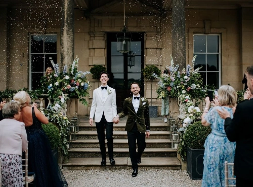 Happy Couple Are Greeted By Guests Following Their Ceremony