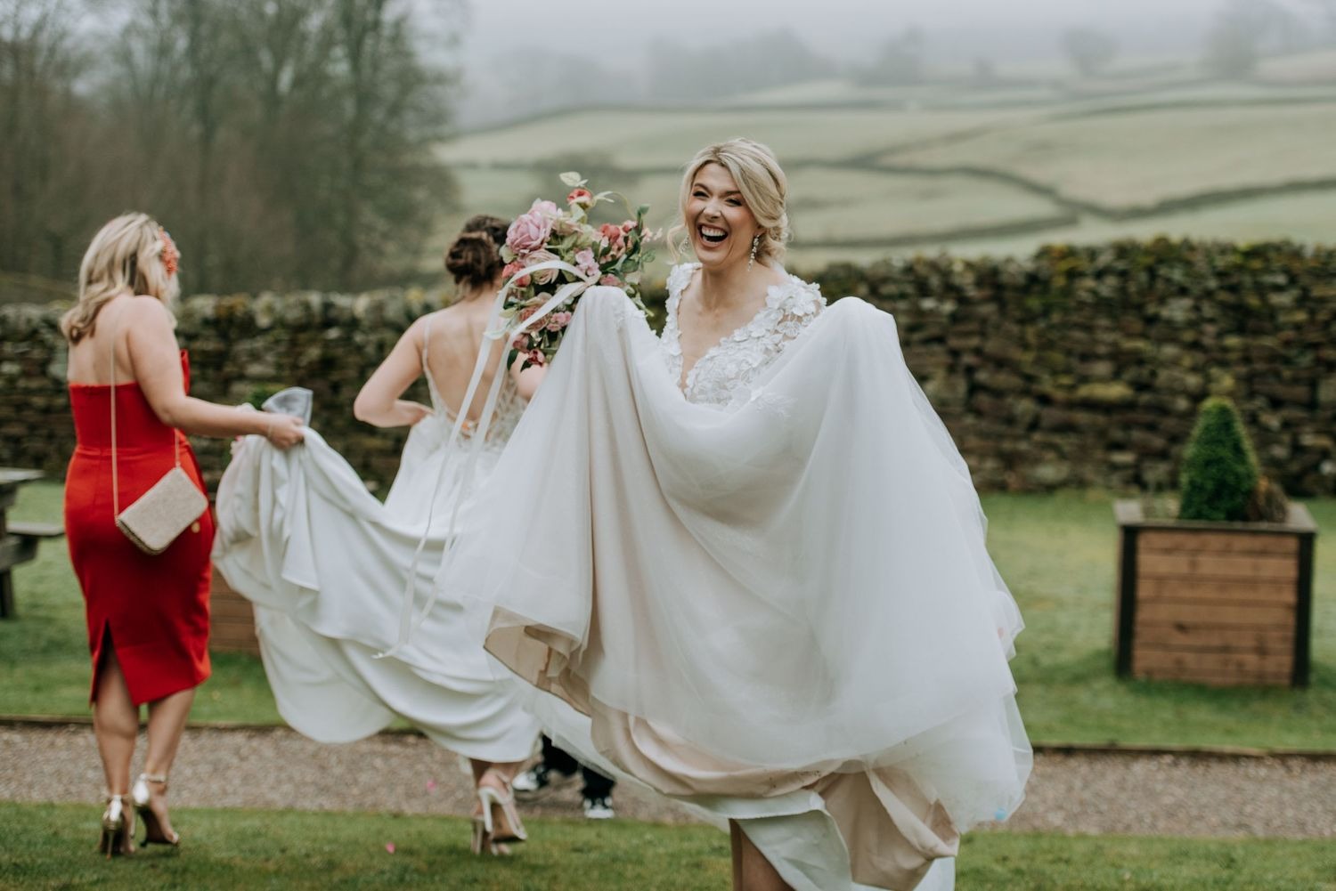 Bridesmaids celebrating outdoors at The Priests House wedding