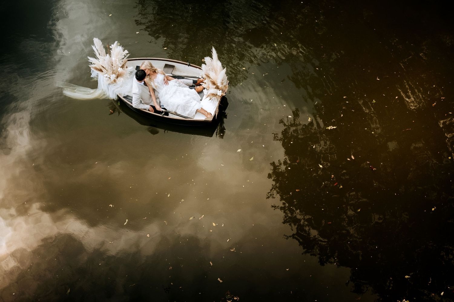 Bride and groom portrait beside lake in Lincolnshire