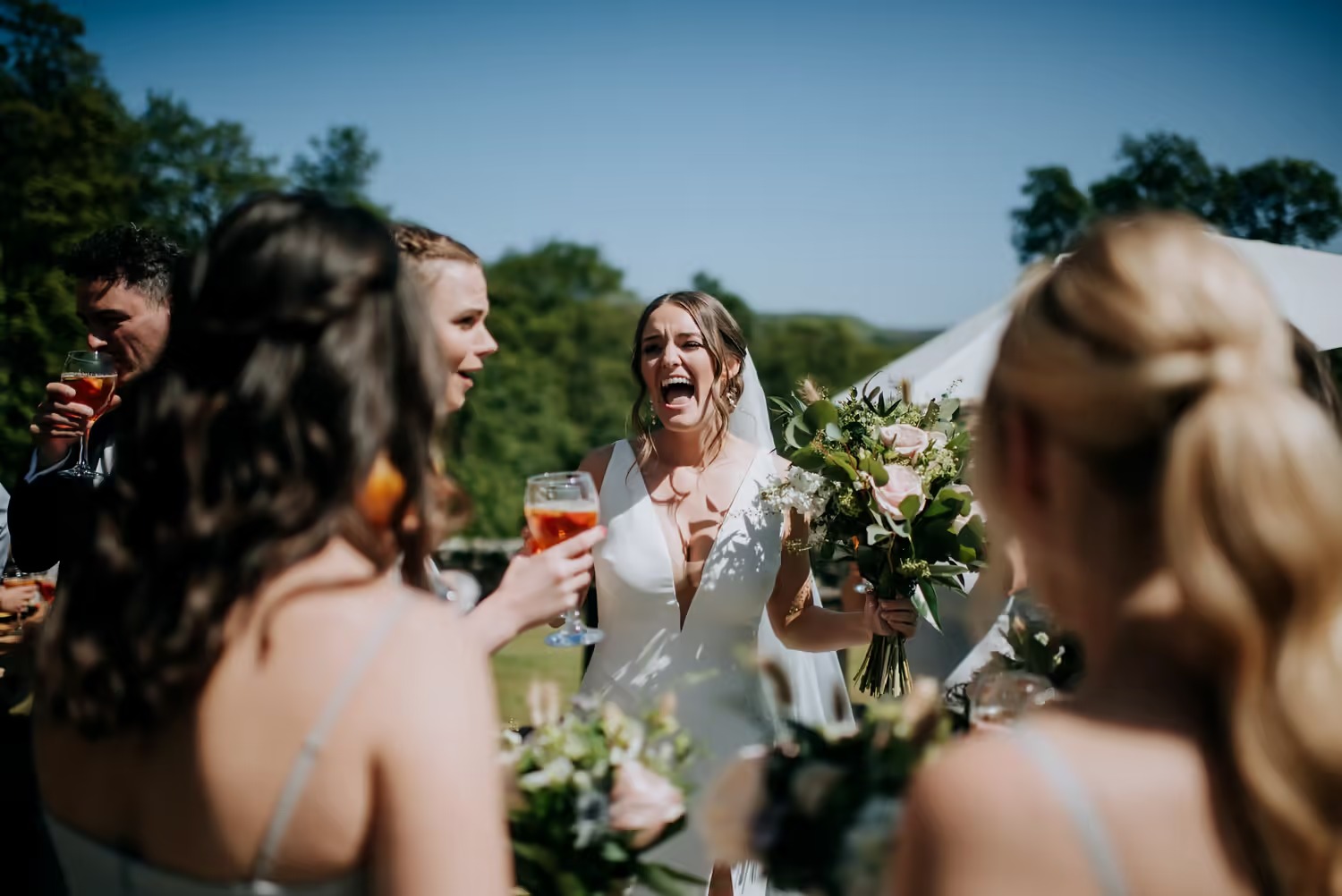 Guests celebrating during outdoor wedding reception at The Priests House
