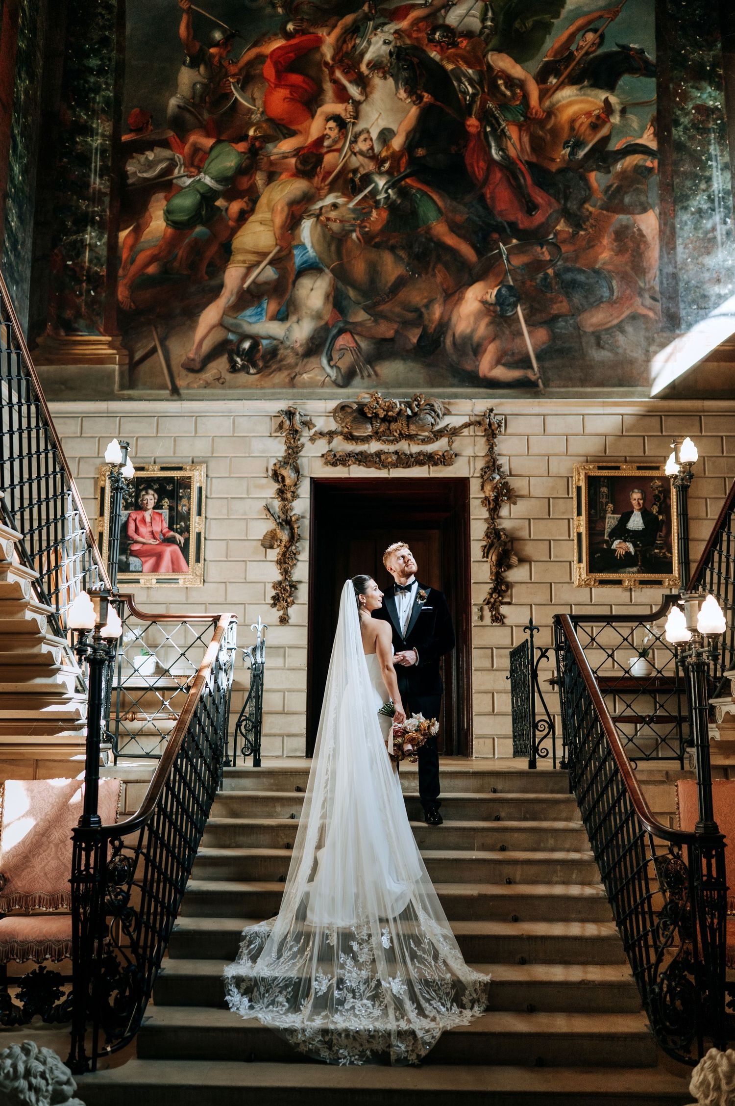 Bride portrait on grand staircase at Lincolnshire wedding venue