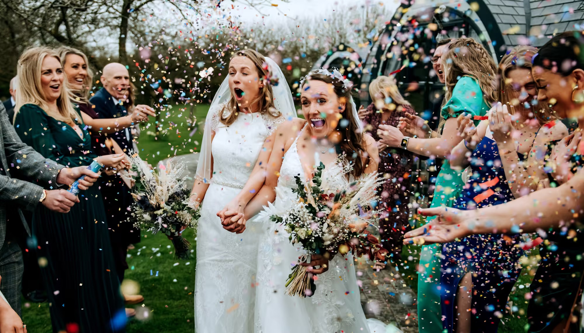 The happy couple confetti throwing over them at willerby barn wedding