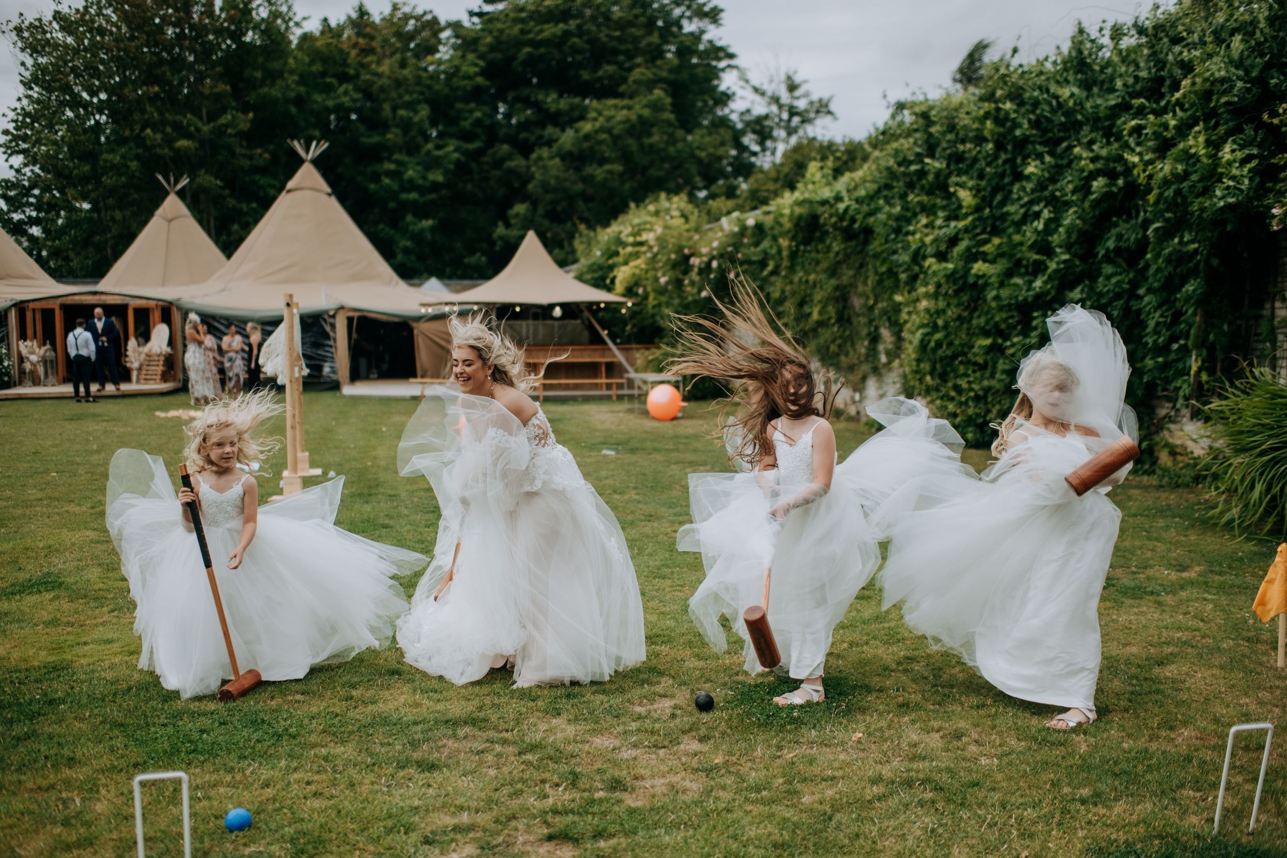 Bridesmaids playing garden games at Scrivelsby wedding venue