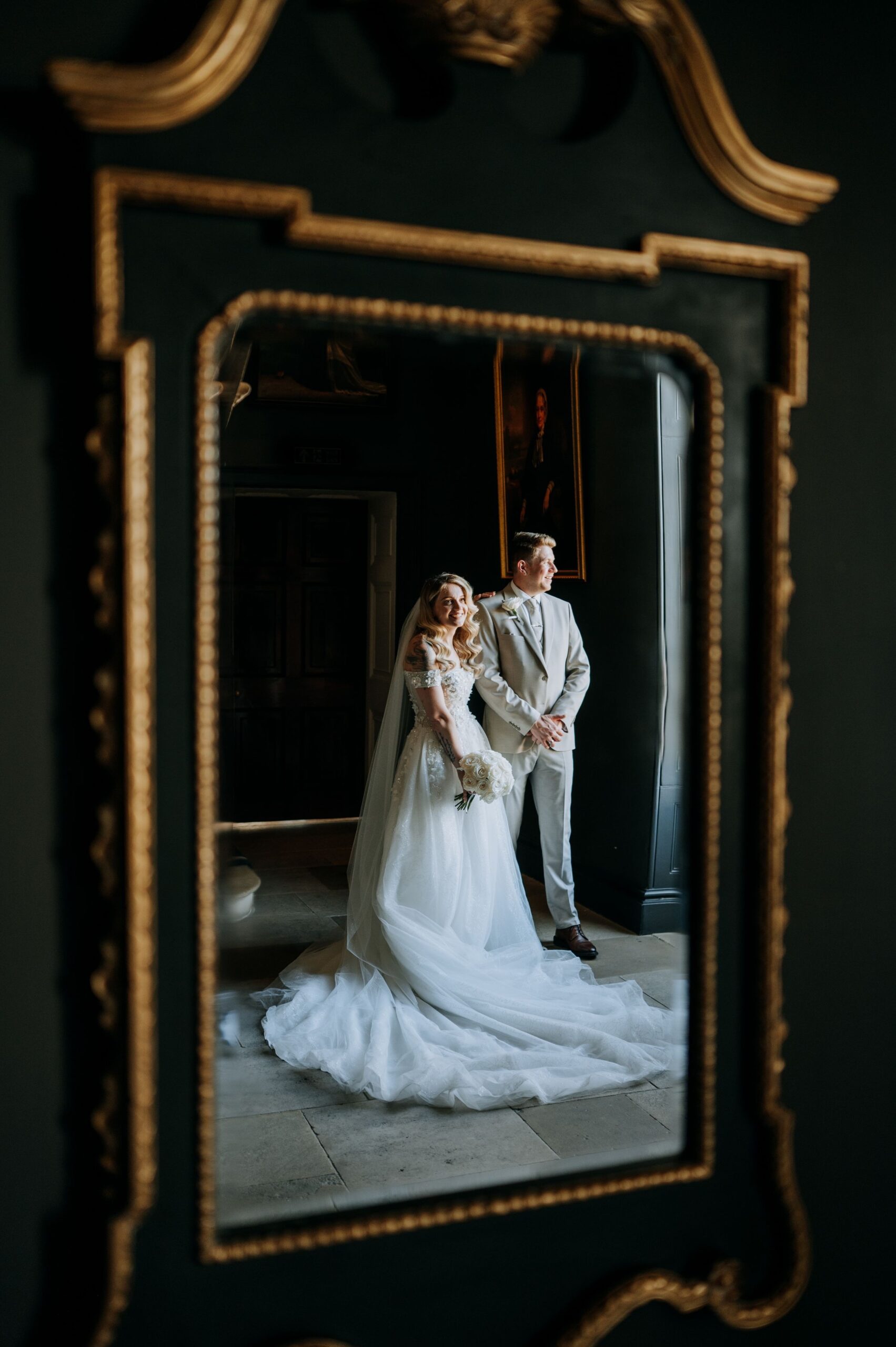 Bride and groom reflection portrait at Stubton Hall wedding venue