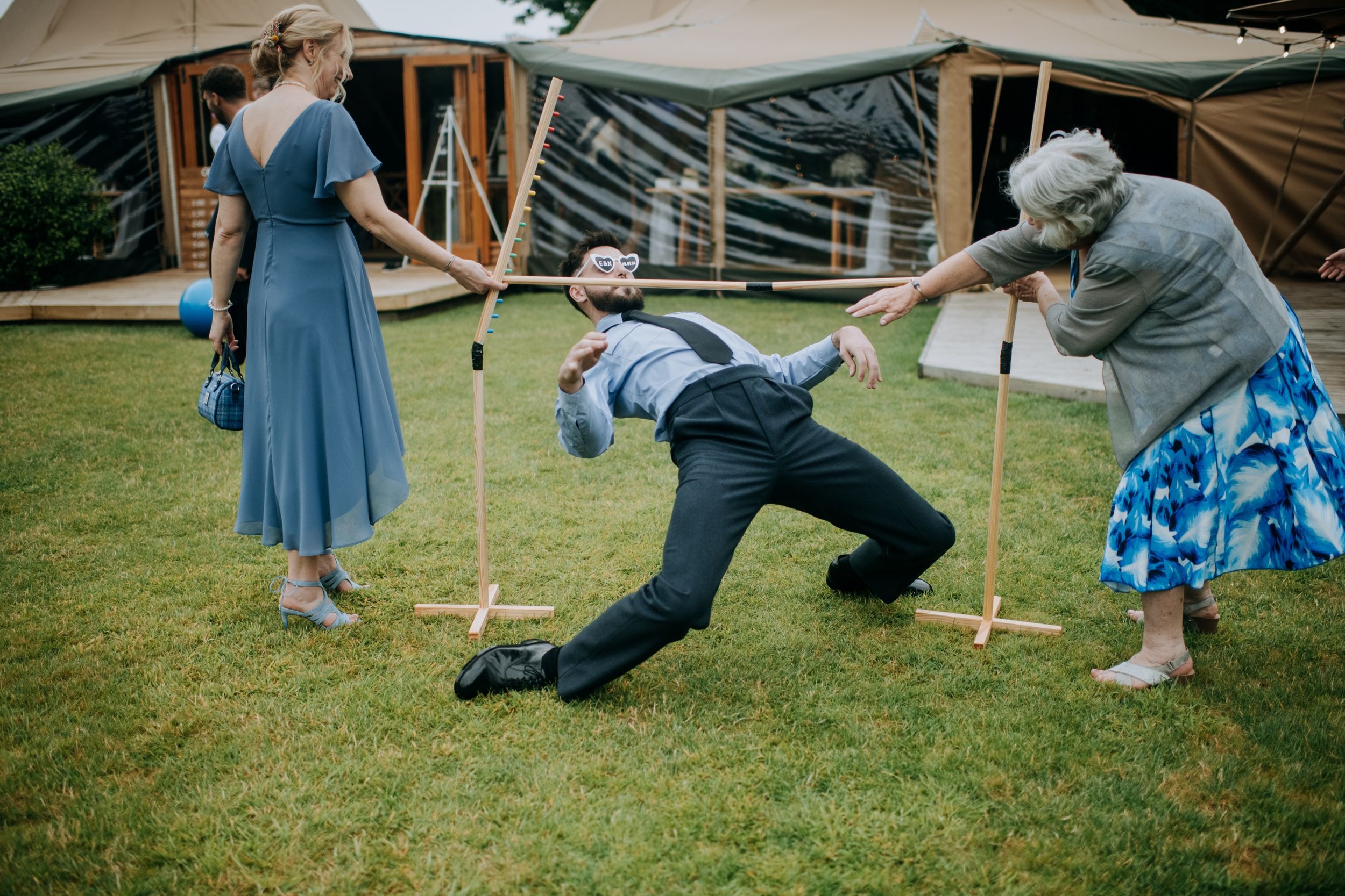 Guests enjoying outdoor garden games at Scrivelsby wedding