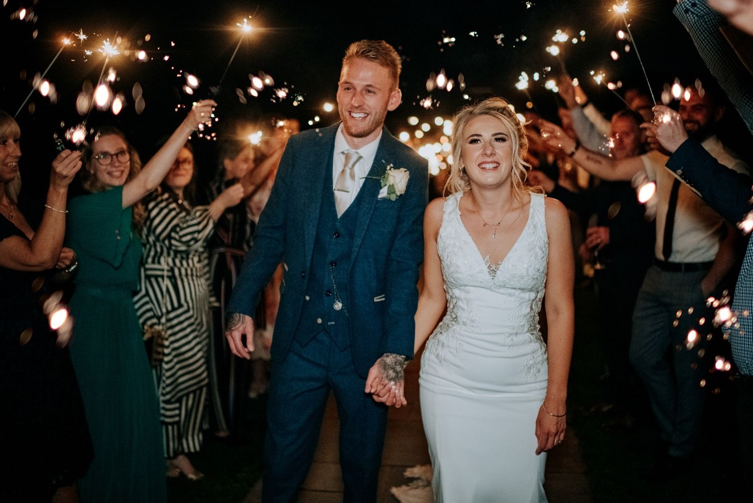 Guests celebrating with sparklers at Lincolnshire wedding reception