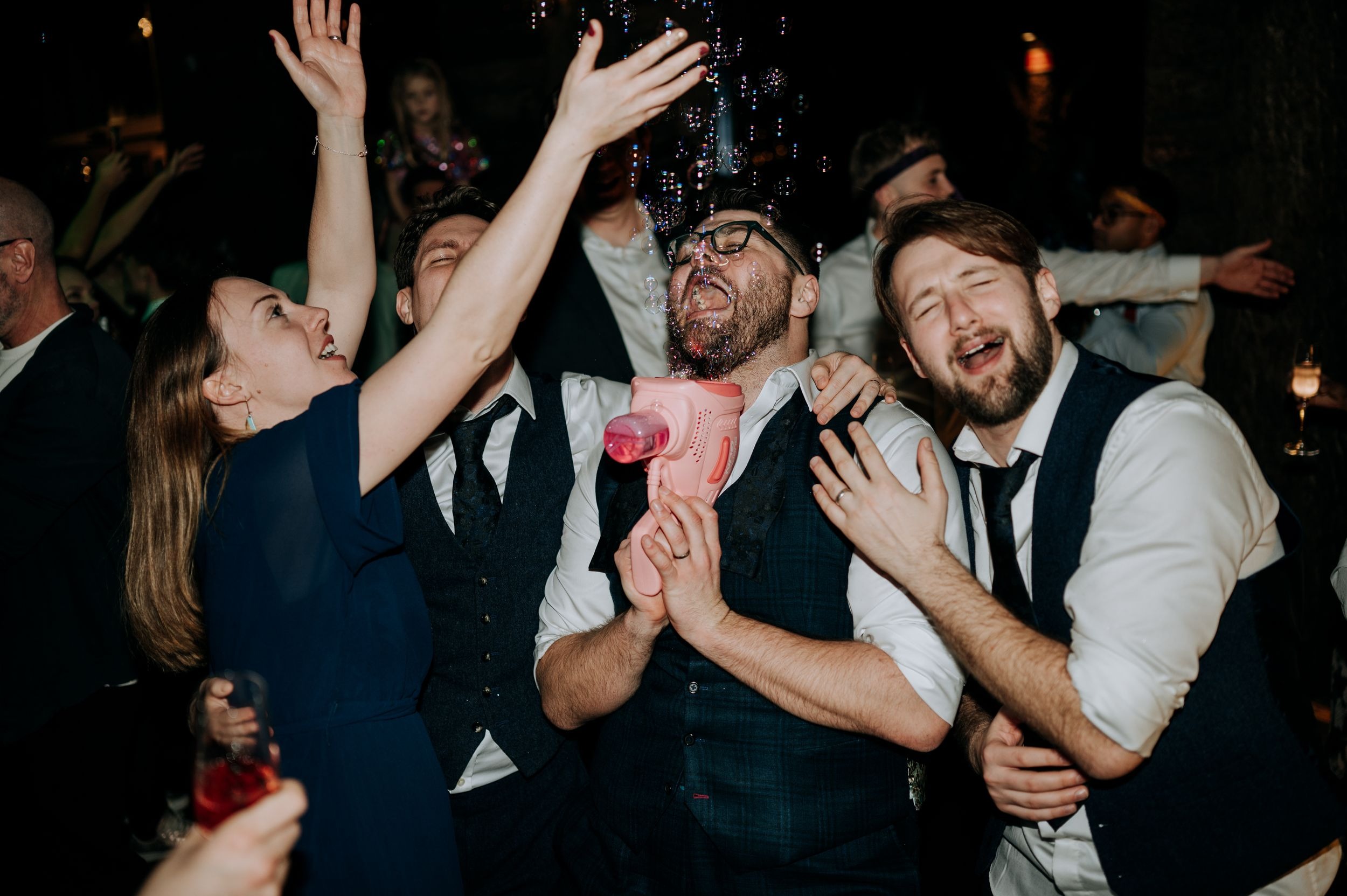 Guests dancing during evening wedding reception at Oaklands wedding venue