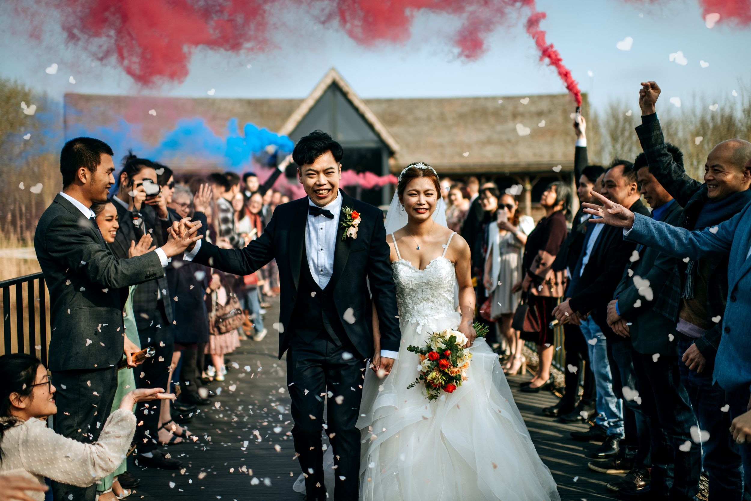 Bride and groom confetti entrance at Oaklands wedding venue