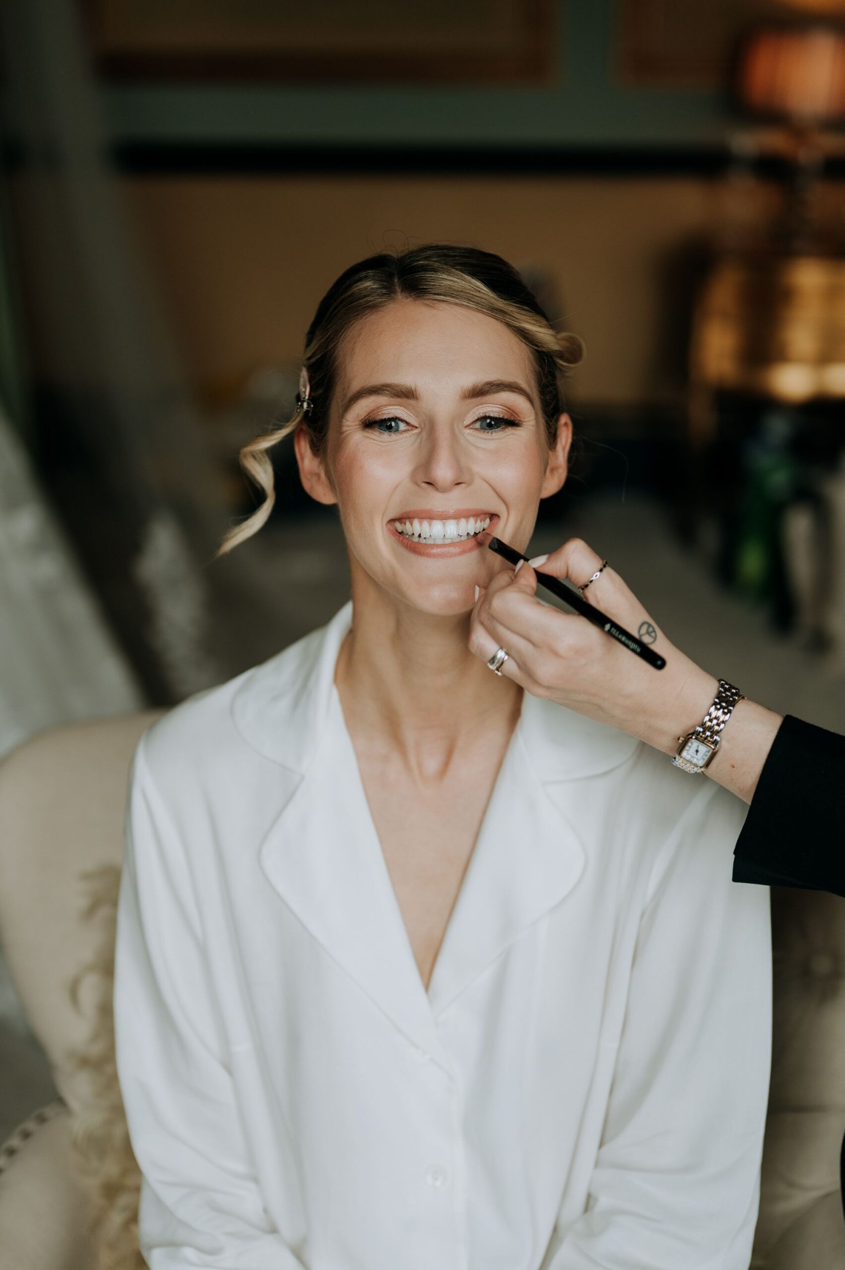 Bride getting ready on wedding morning at Rise Hall