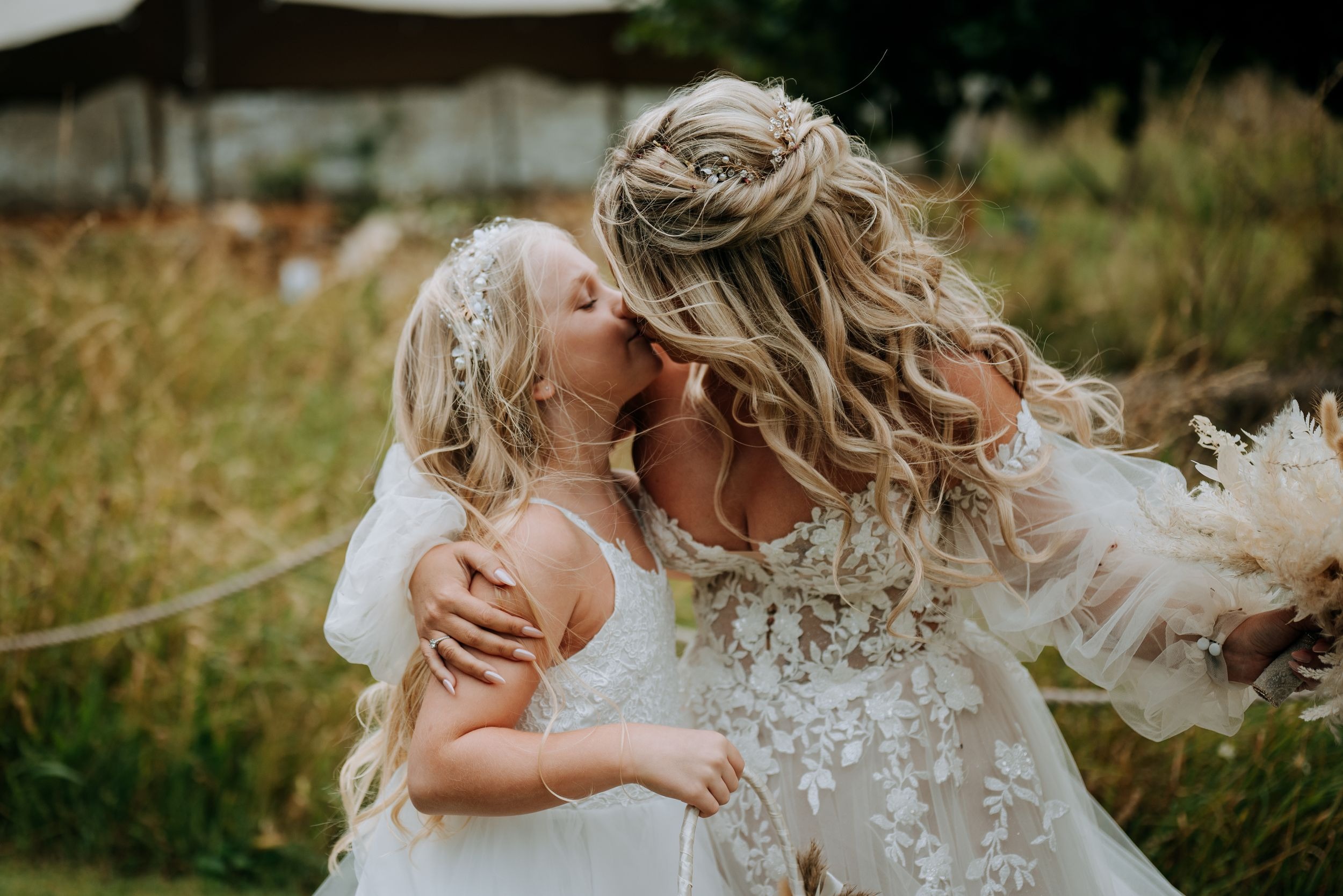 Bride hugging guest during Scrivelsby wedding celebrations