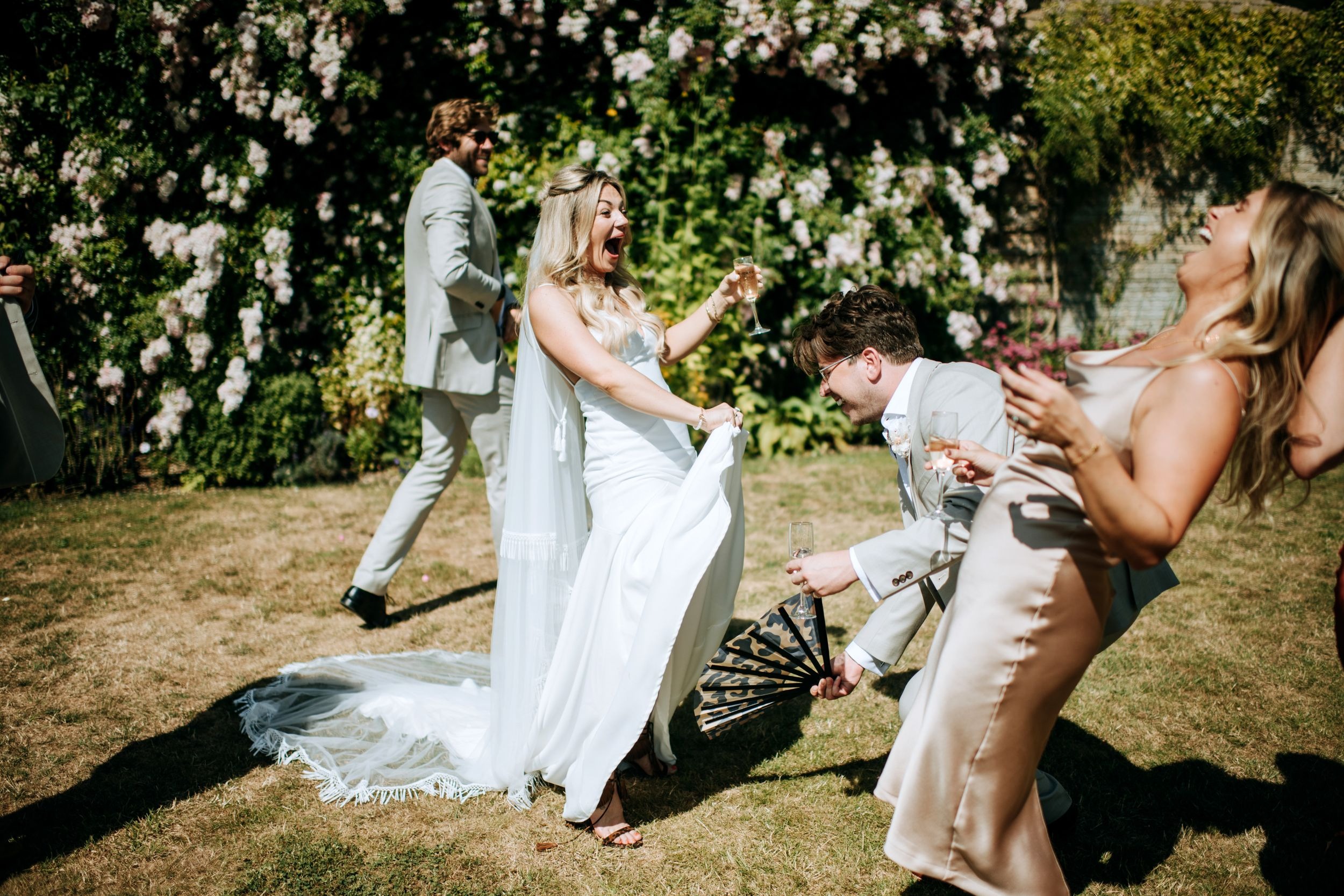 Bridesmaids celebrating outdoors at Scrivelsby wedding venue