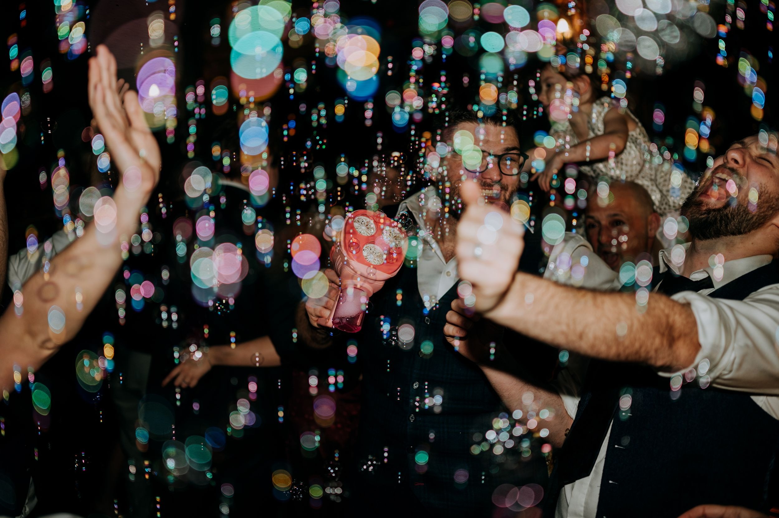 Champagne spray celebration during Oaklands wedding party