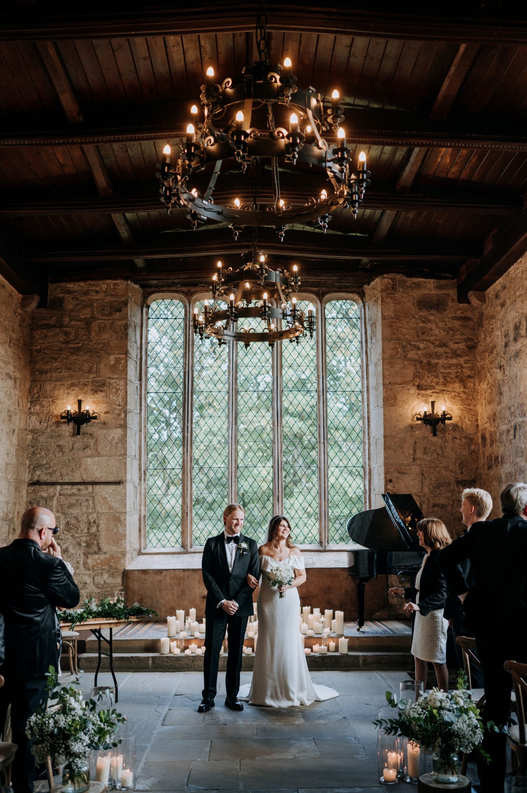 Wedding ceremony beneath chandeliers at The Priests House