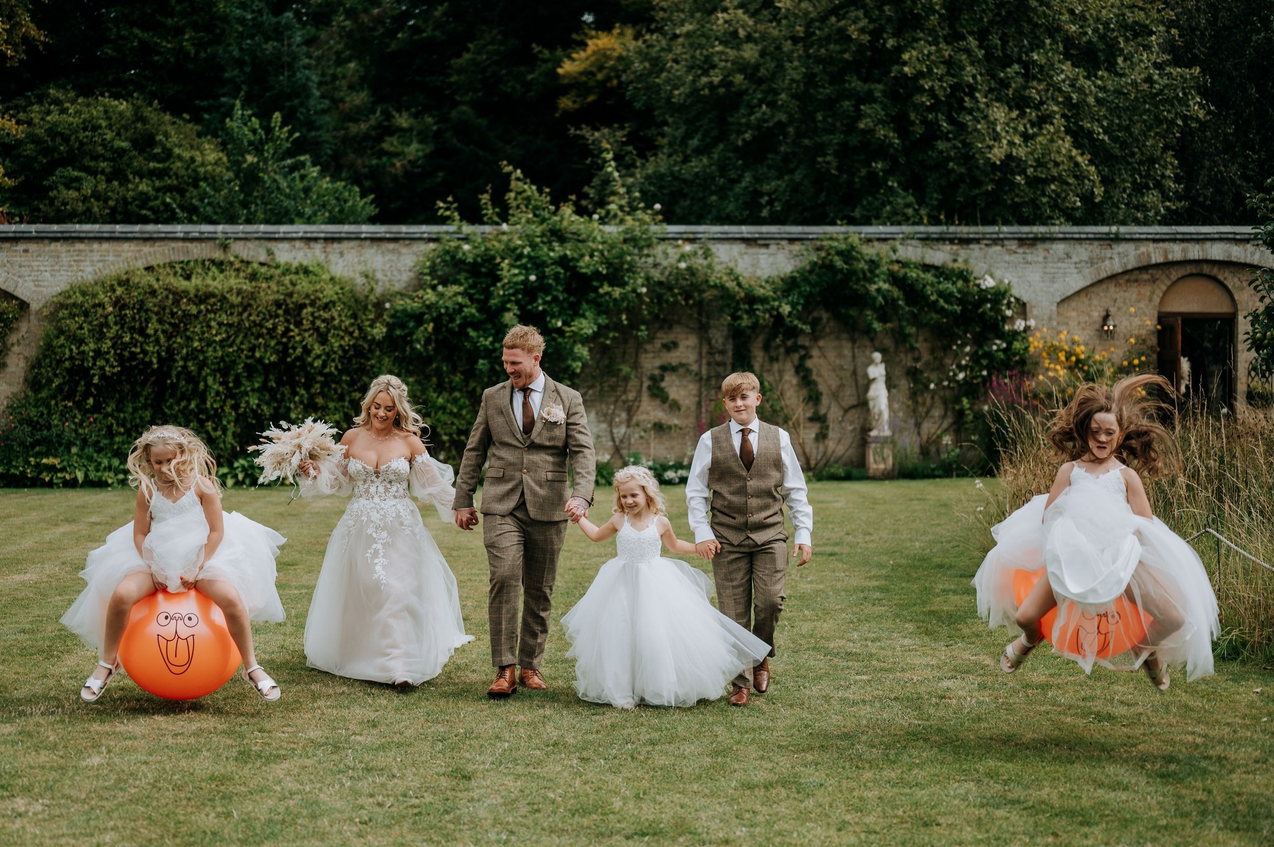 Bridesmaids enjoying garden games at Scrivelsby wedding venue