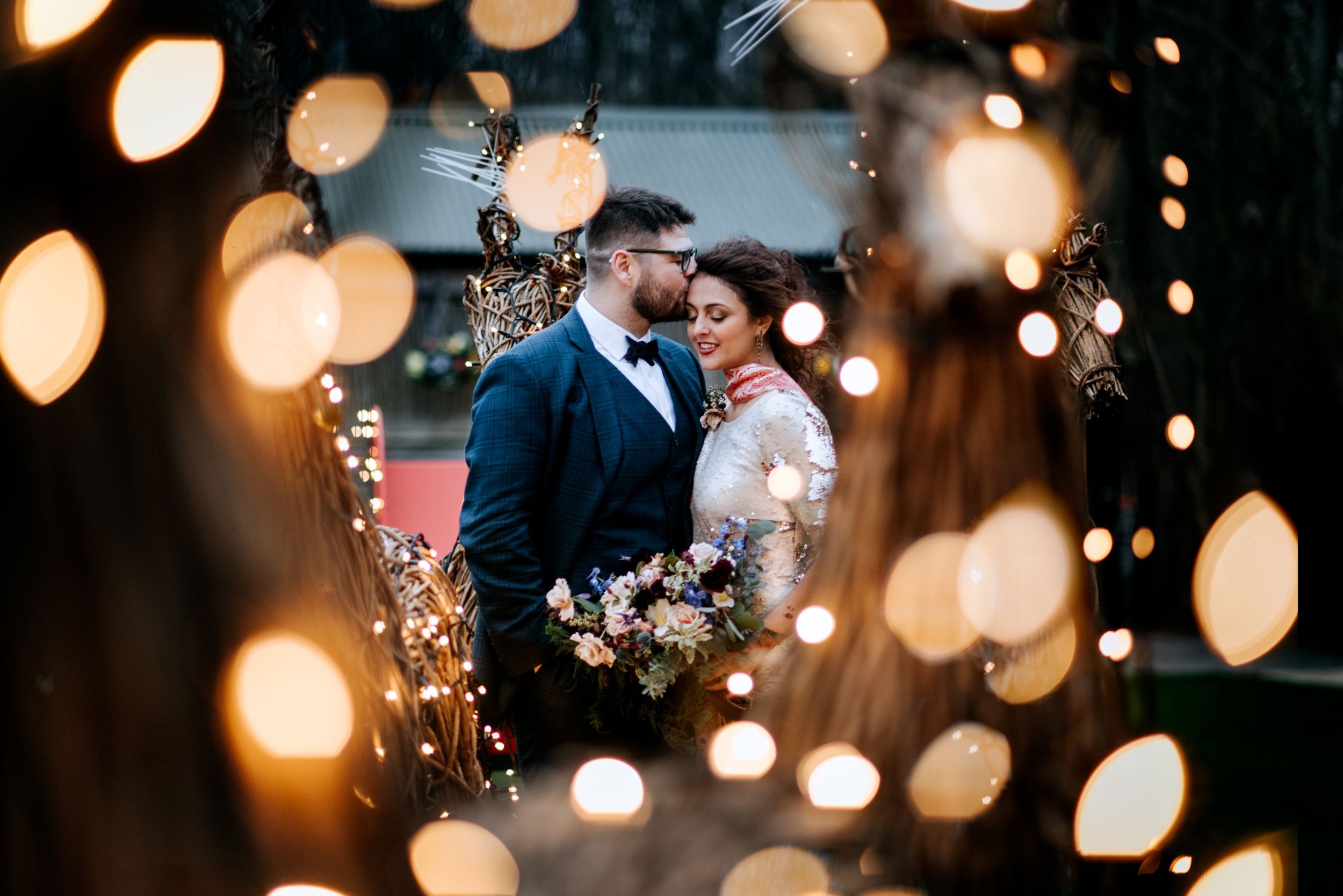 Romantic evening portrait at Oaklands wedding venue with fairy lights