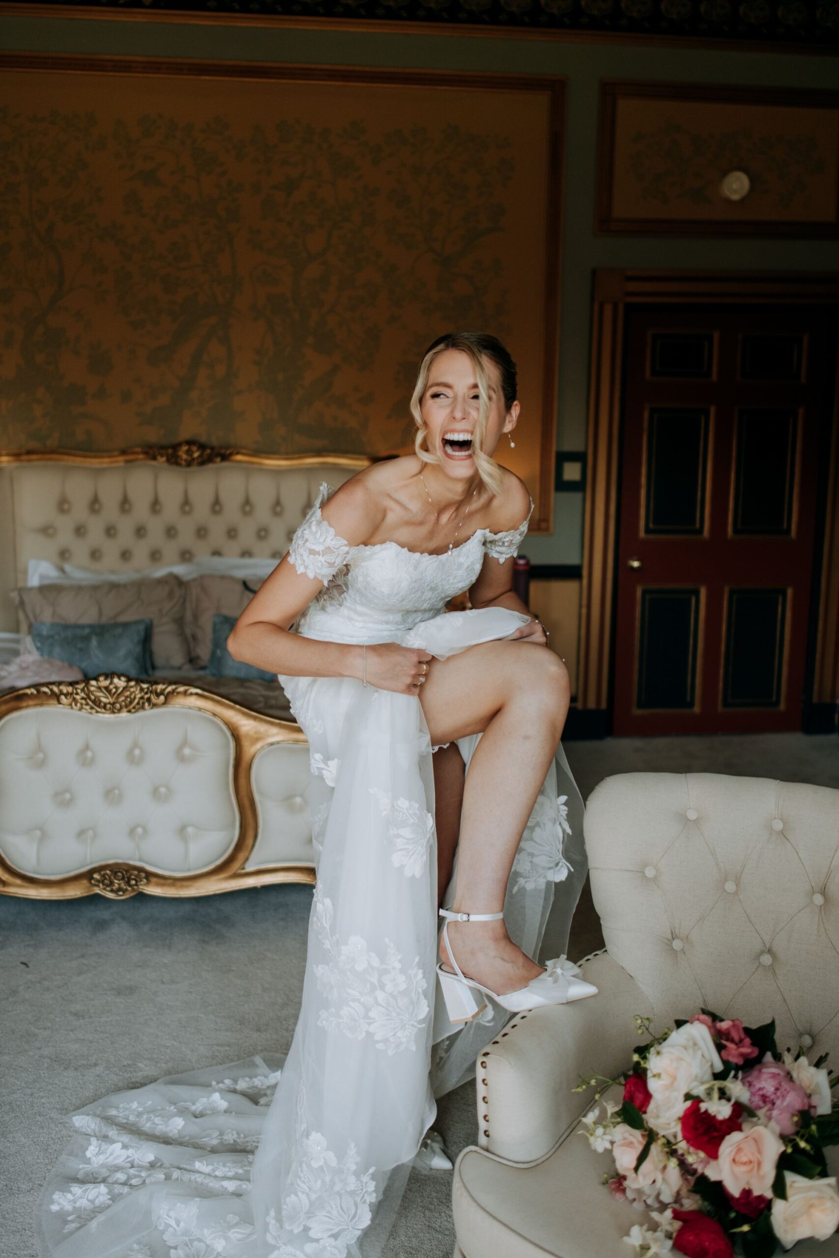 Bride Laughing in bridal suite at Rise Hall wedding venue