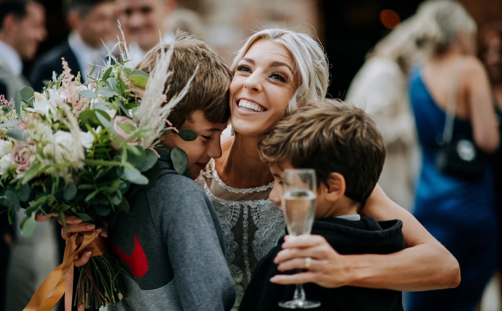 Bride hugging guests during wedding celebrations at The Normans