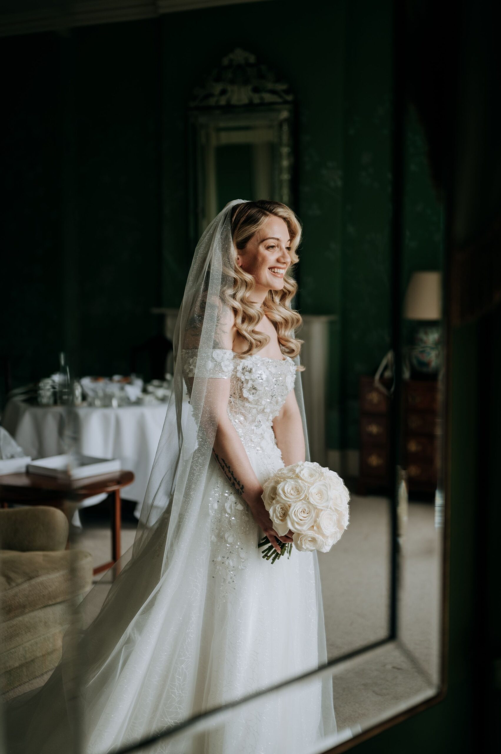 Bride portrait reflected in mirror at Stubton Hall wedding venue