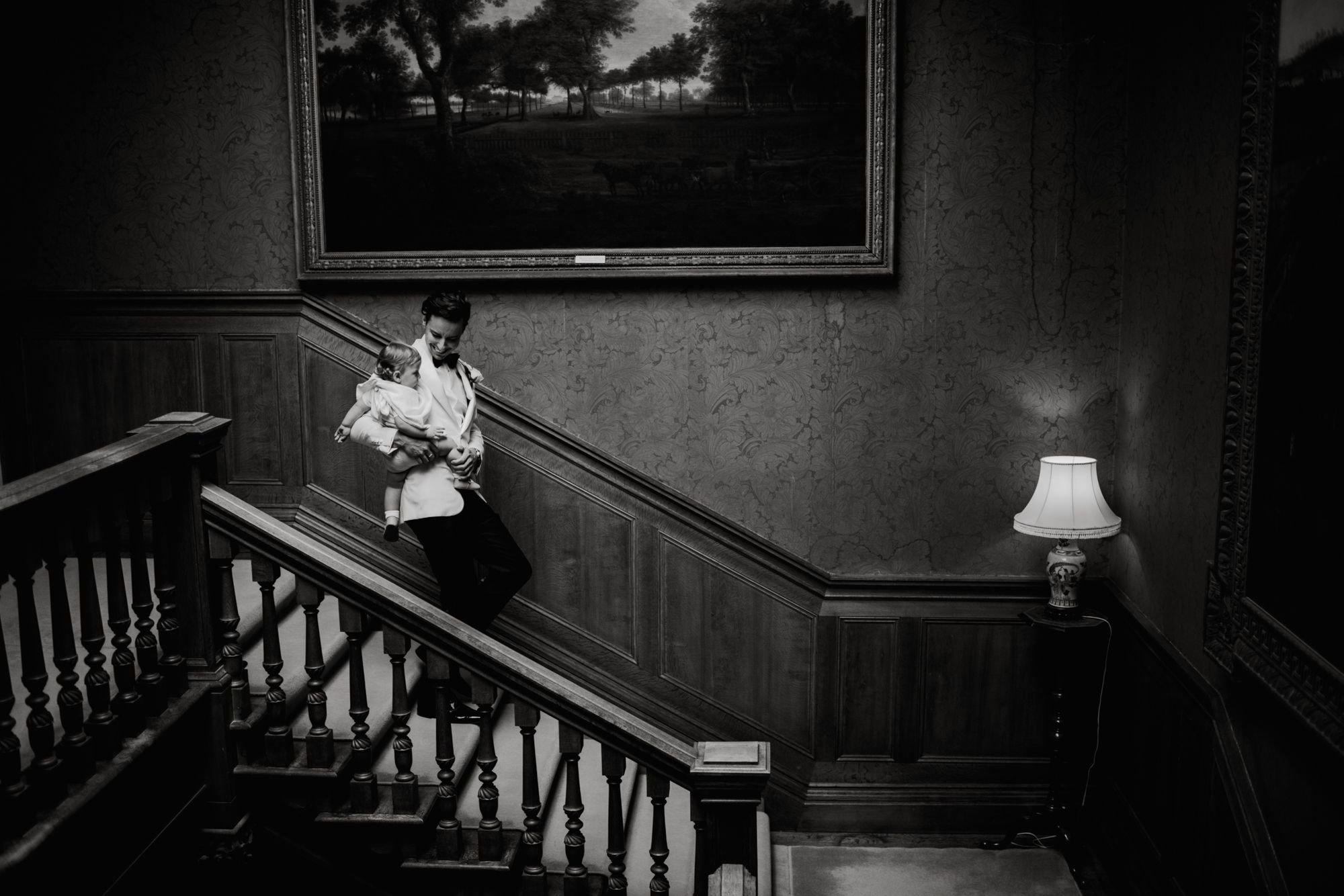 Birdsall House Wedding Photograph of the groom on the stairs