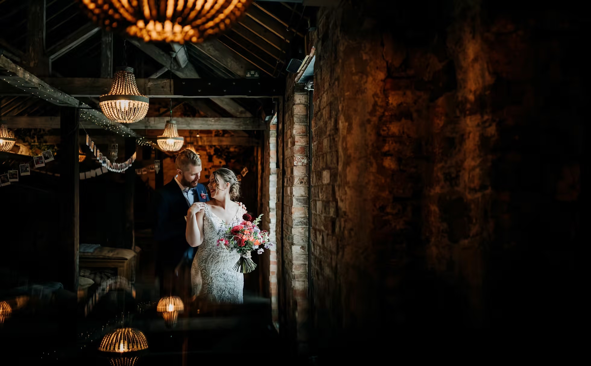 Bride and groom dancing inside The Normans wedding venue