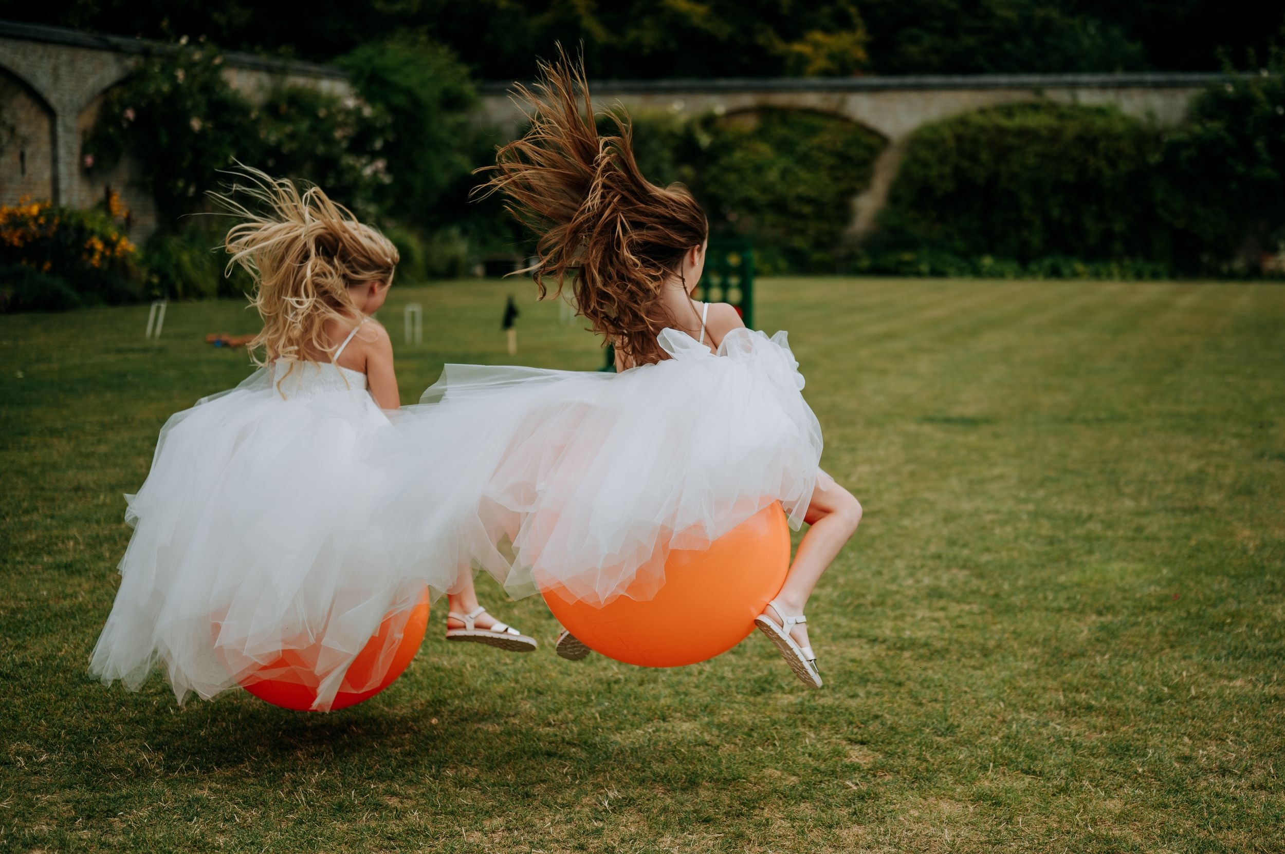 Bridesmaids celebrating with garden games at Scrivelsby wedding