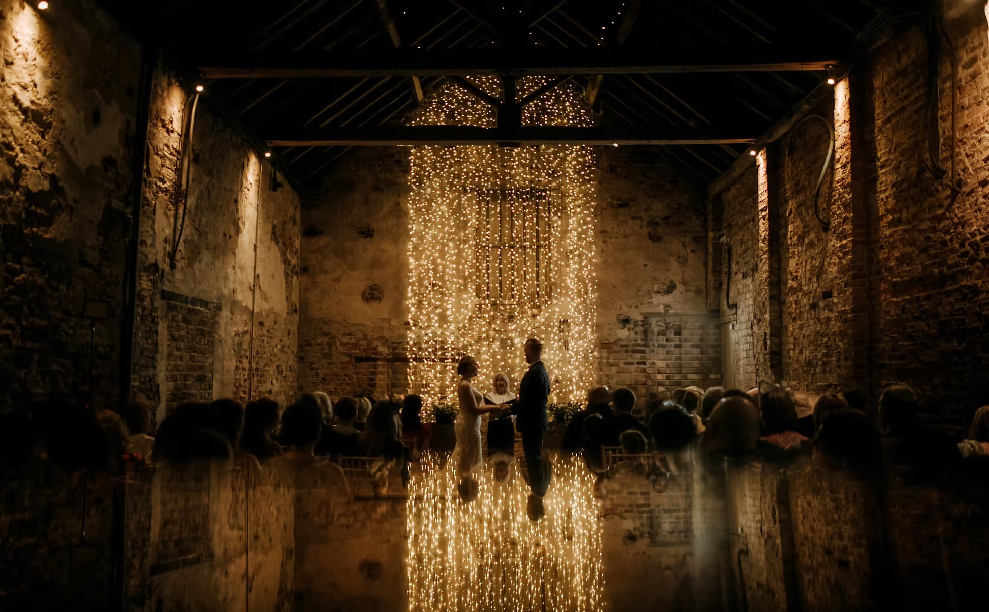 Wedding ceremony inside The Normans barn wedding venue