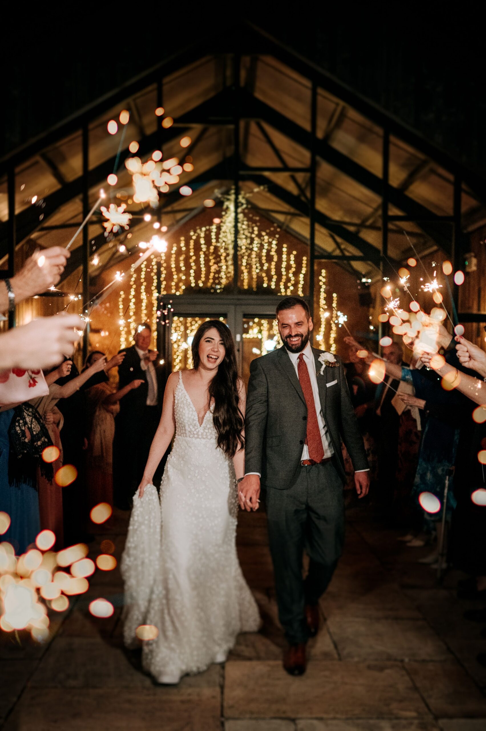 Bride and groom entering wedding reception at Little Wold Vineyard