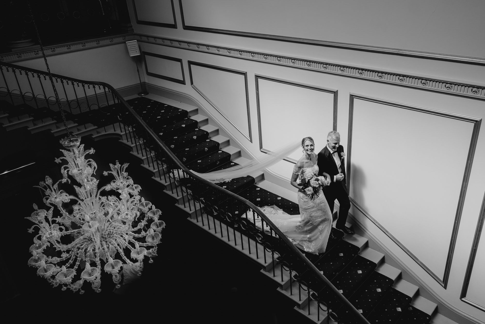 Black and white wedding staircase photograph at Rise Hall