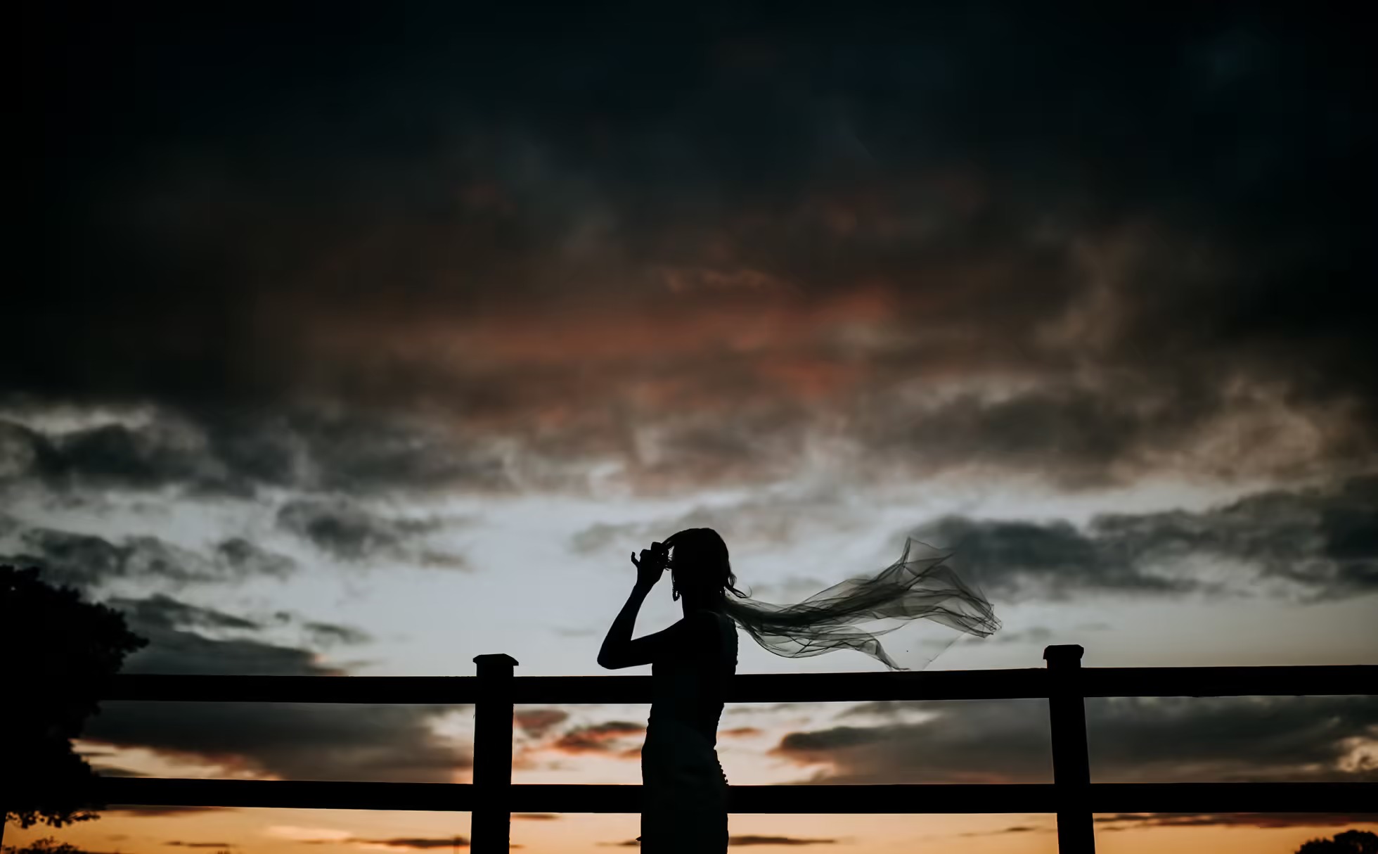 Dramatic evening silhouette portrait at The Normans wedding venue