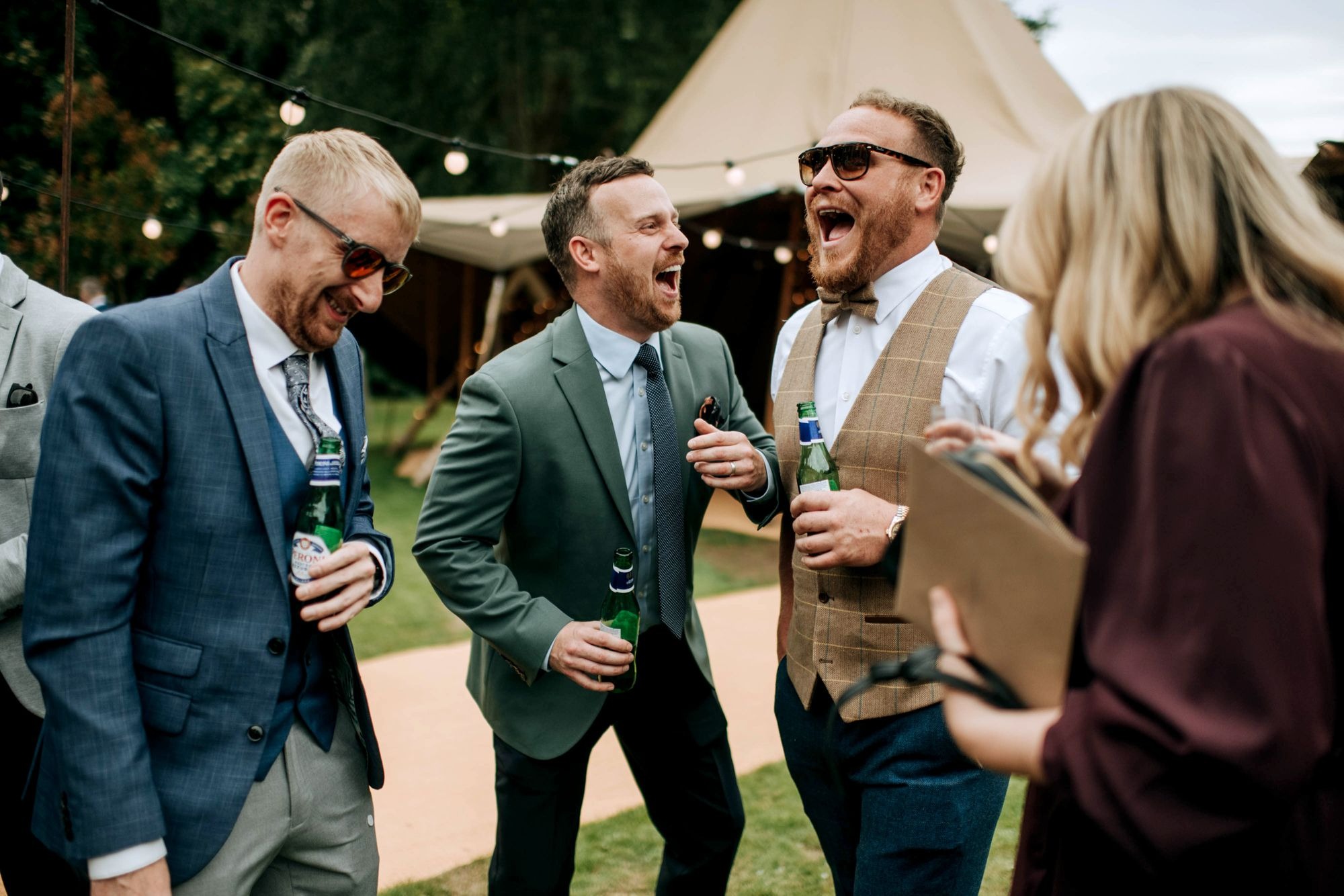 Wedding guests enjoying drinks reception at Hirst Priory