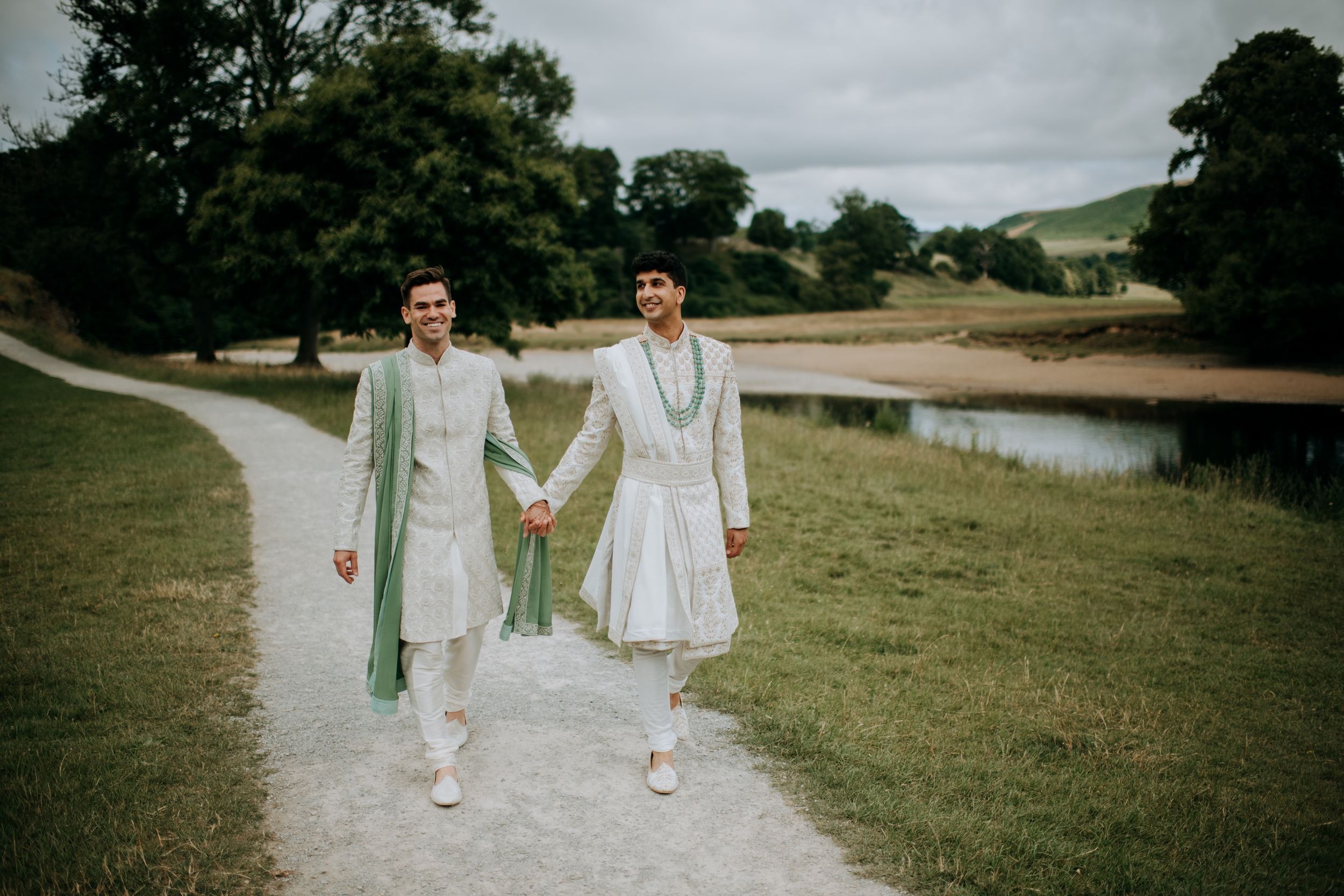 The happy couple walking at Tithe Barn Wedding