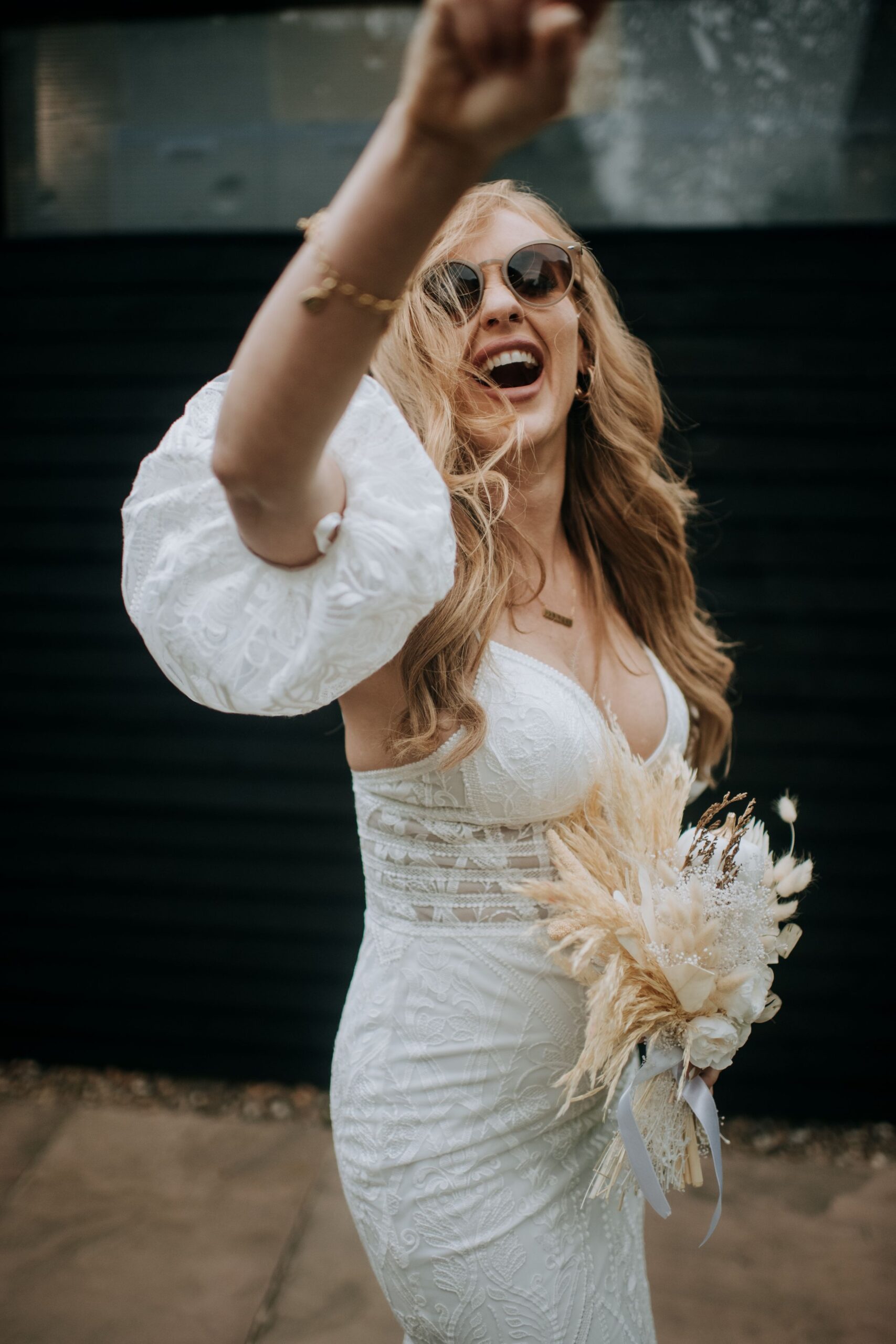 Bride celebrating during wedding reception at Riverlands wedding venue