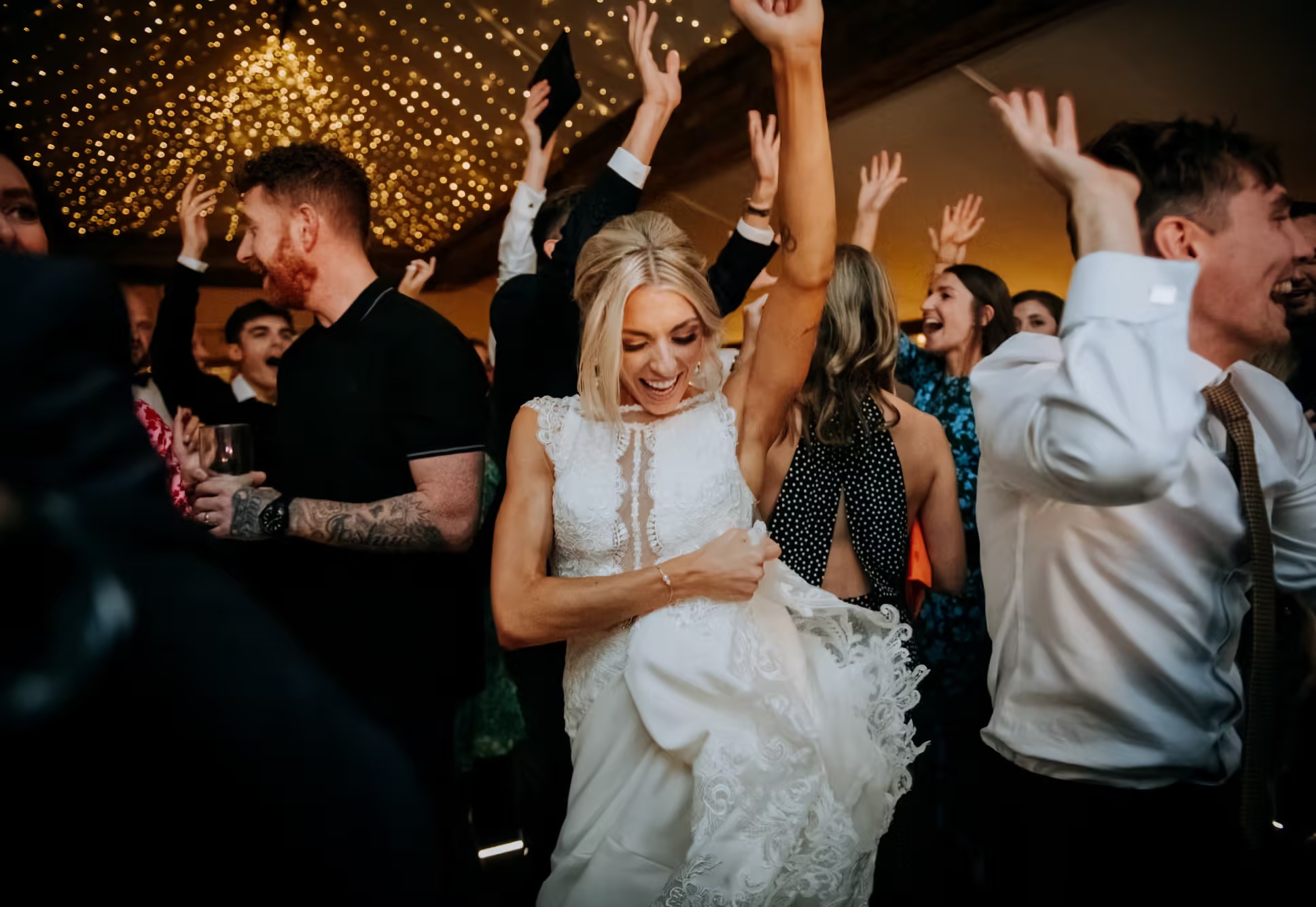 Bride dancing with guests at The Normans wedding reception