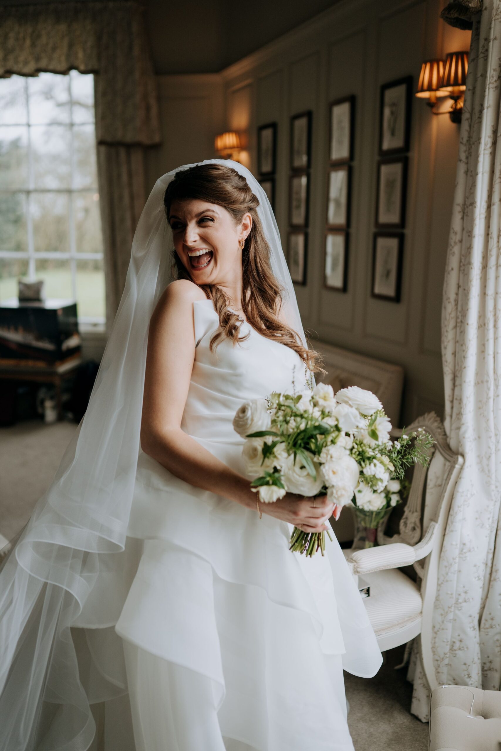 Bride portrait holding bouquet at Wootton Hall wedding venue