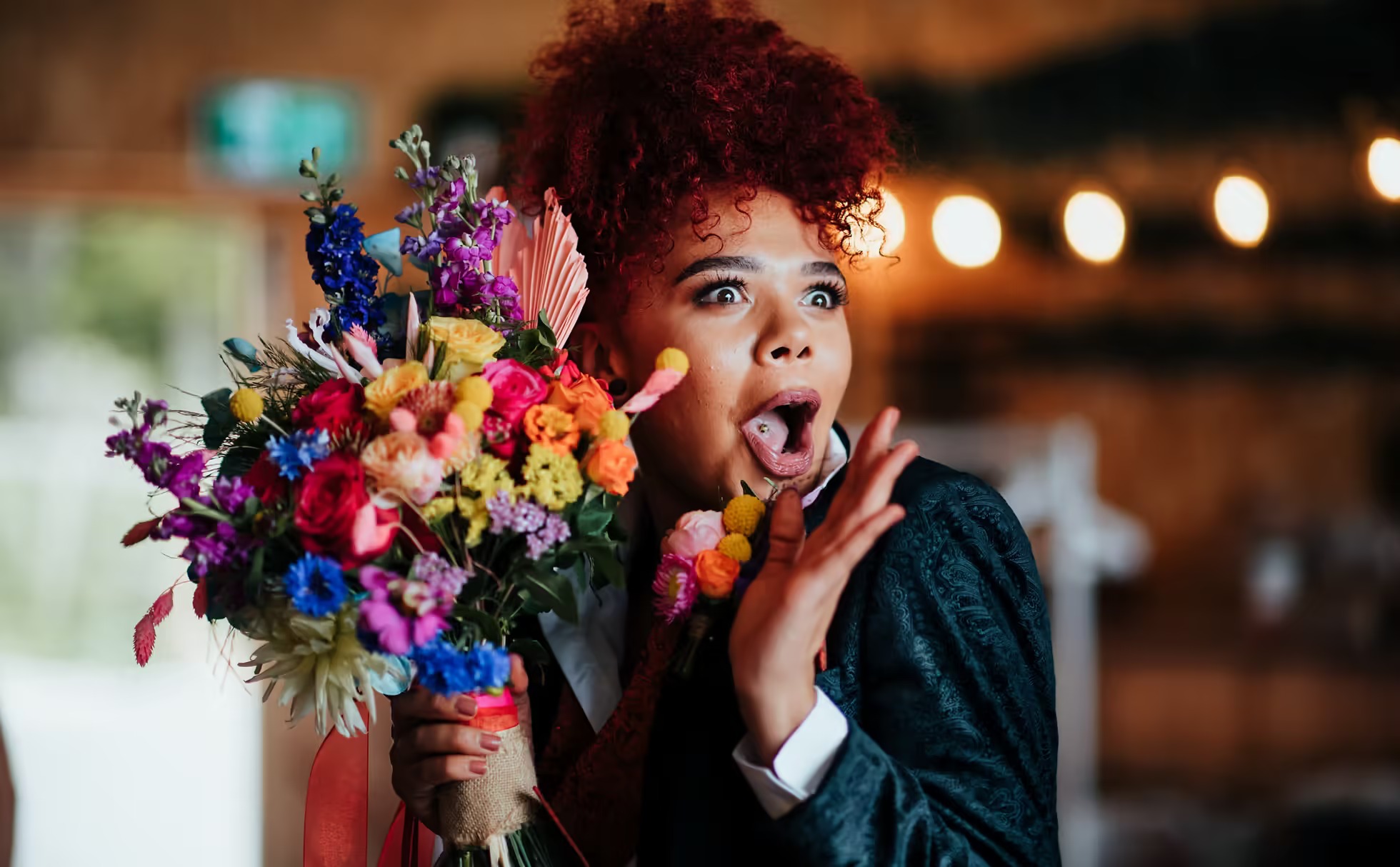 Bride holding colourful bouquet at Little Wold Vineyard wedding