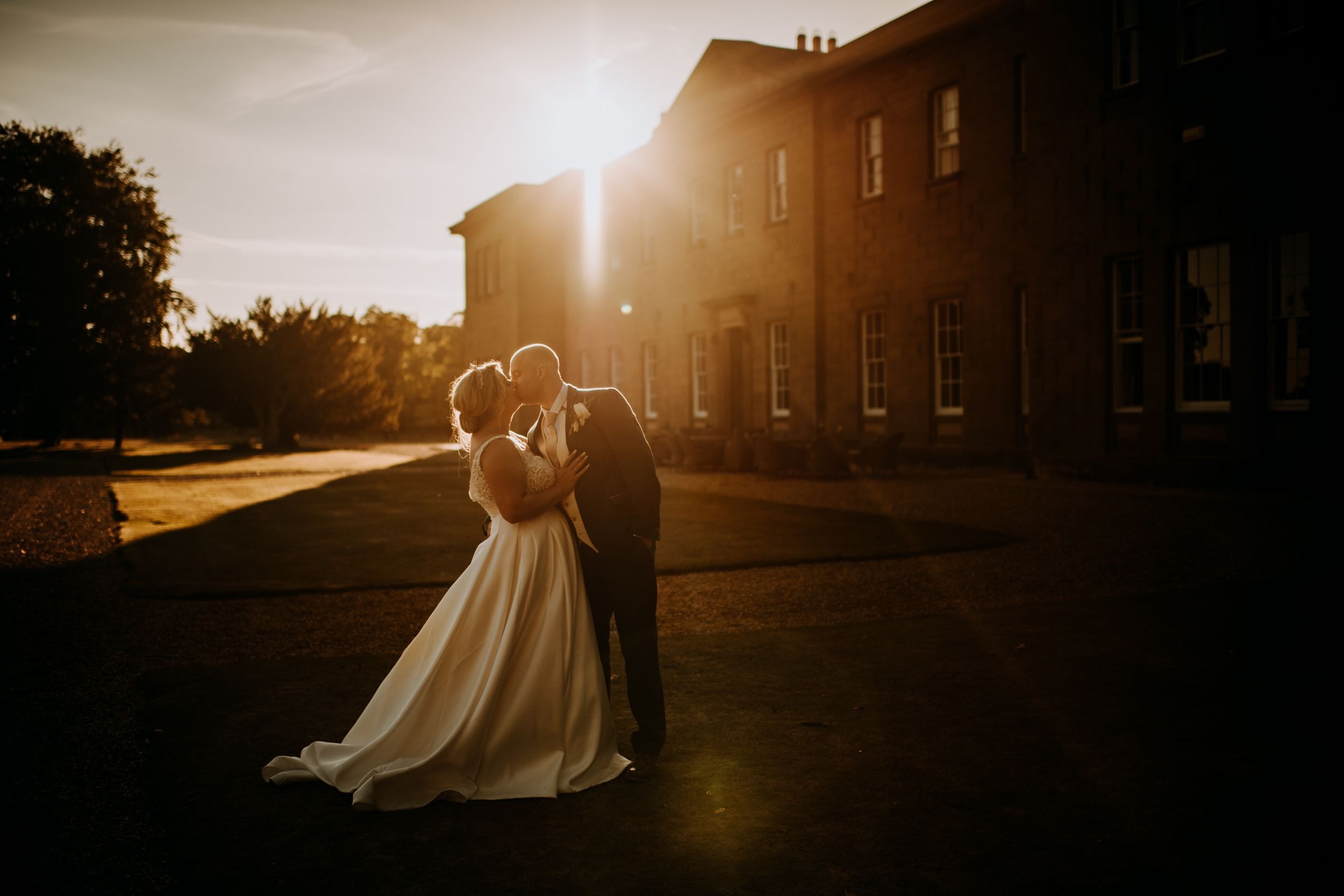 Sunset wedding portrait outside Rise Hall wedding venue