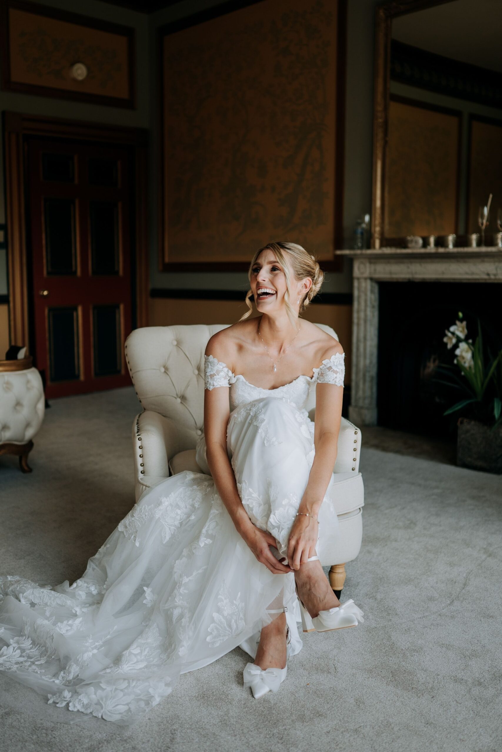 Bride relaxing in bridal suite before ceremony at Rise Hall