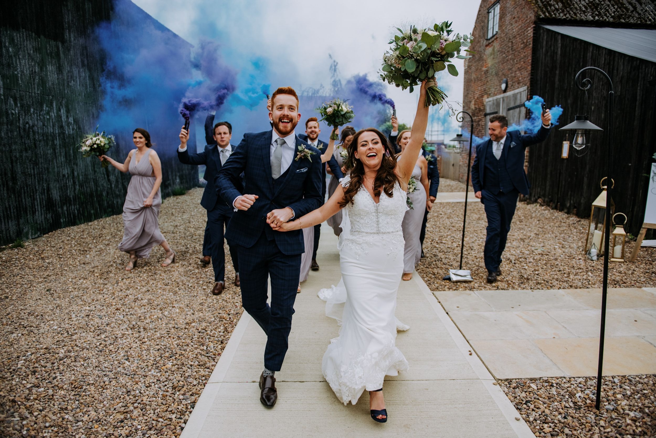 Bride and groom confetti entrance at Riverlands wedding venue