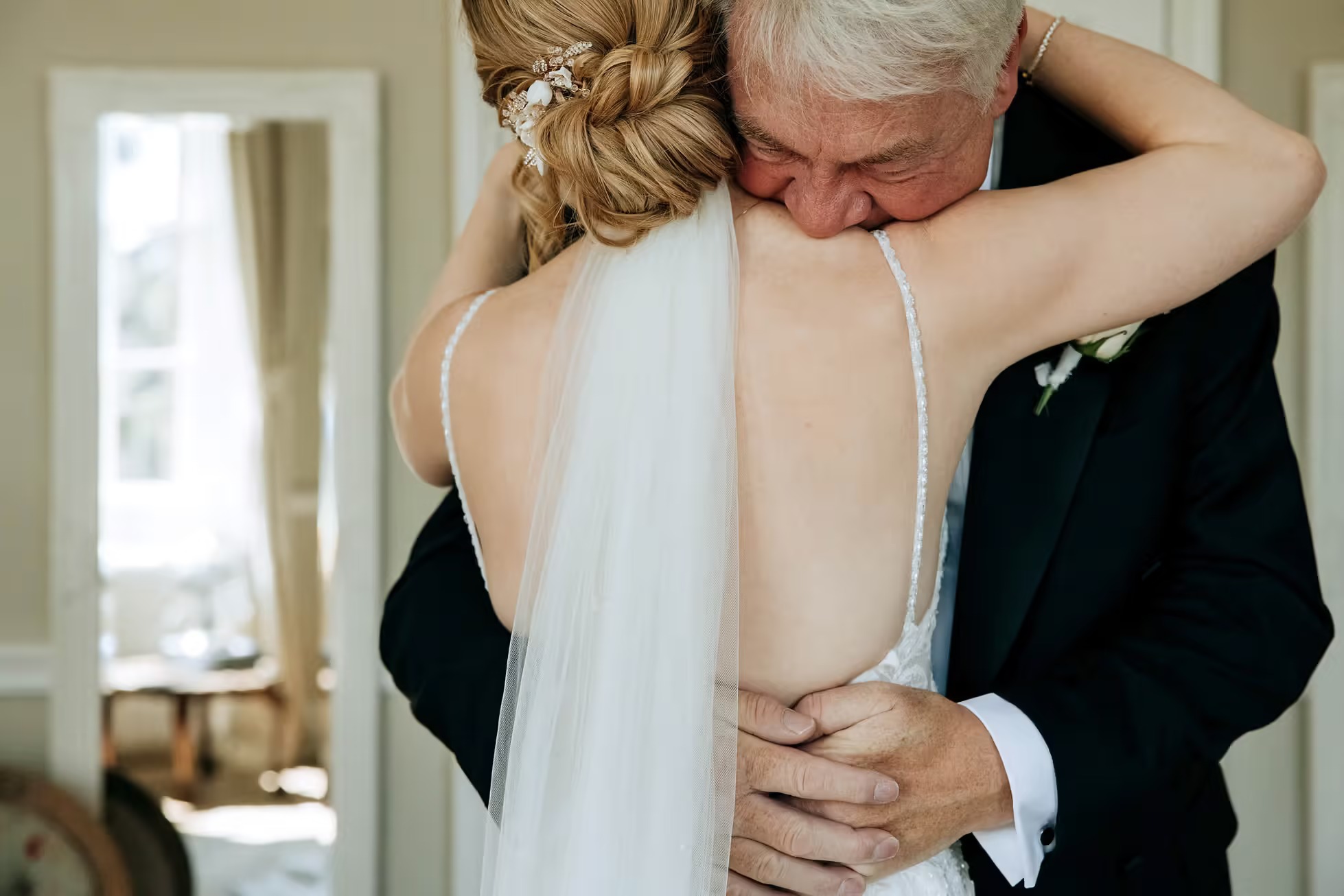 Father of the Bride embracing Bride at a Middleton Lodge Wedding