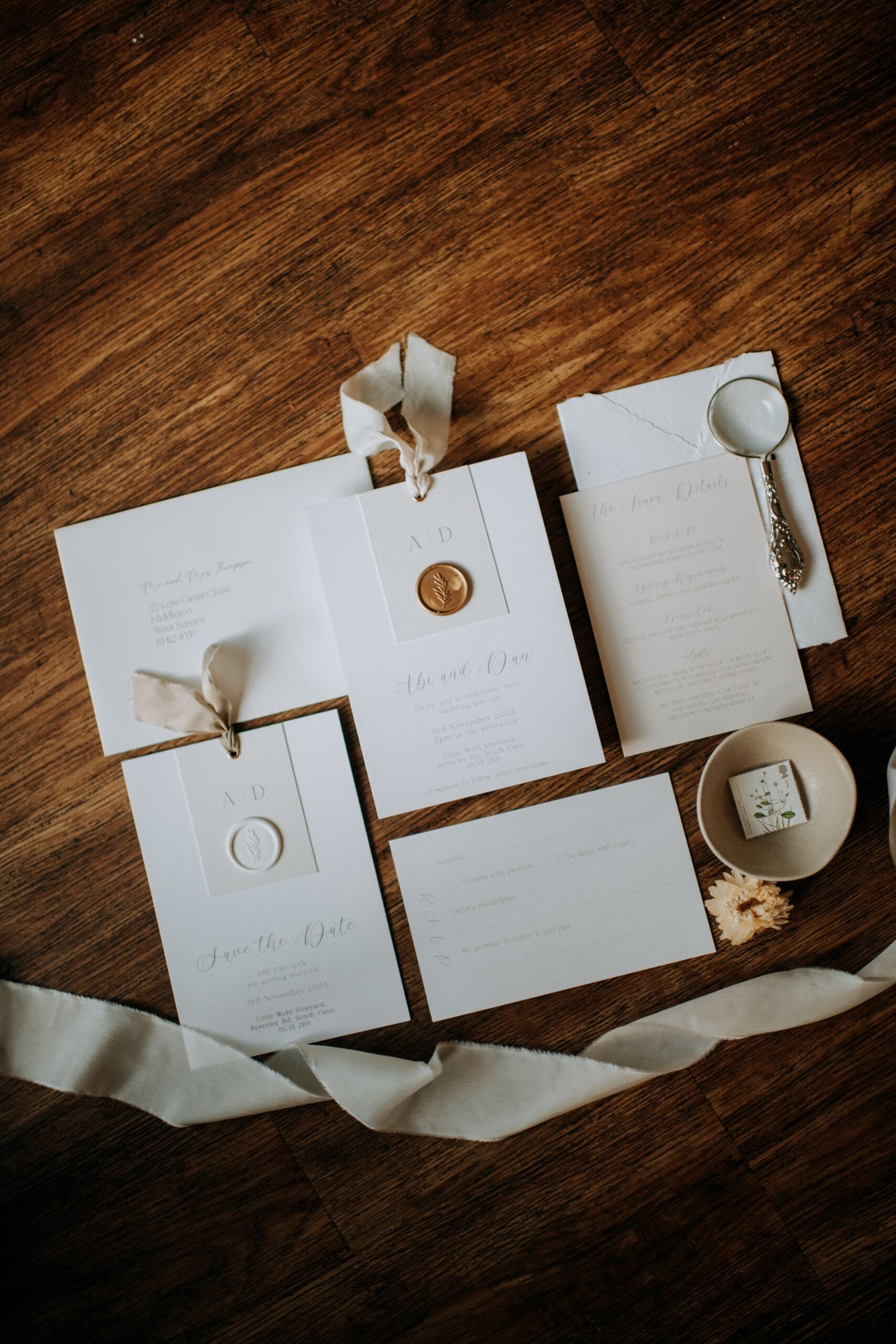 Wedding invitation flat lay at Little Wold Vineyard wedding