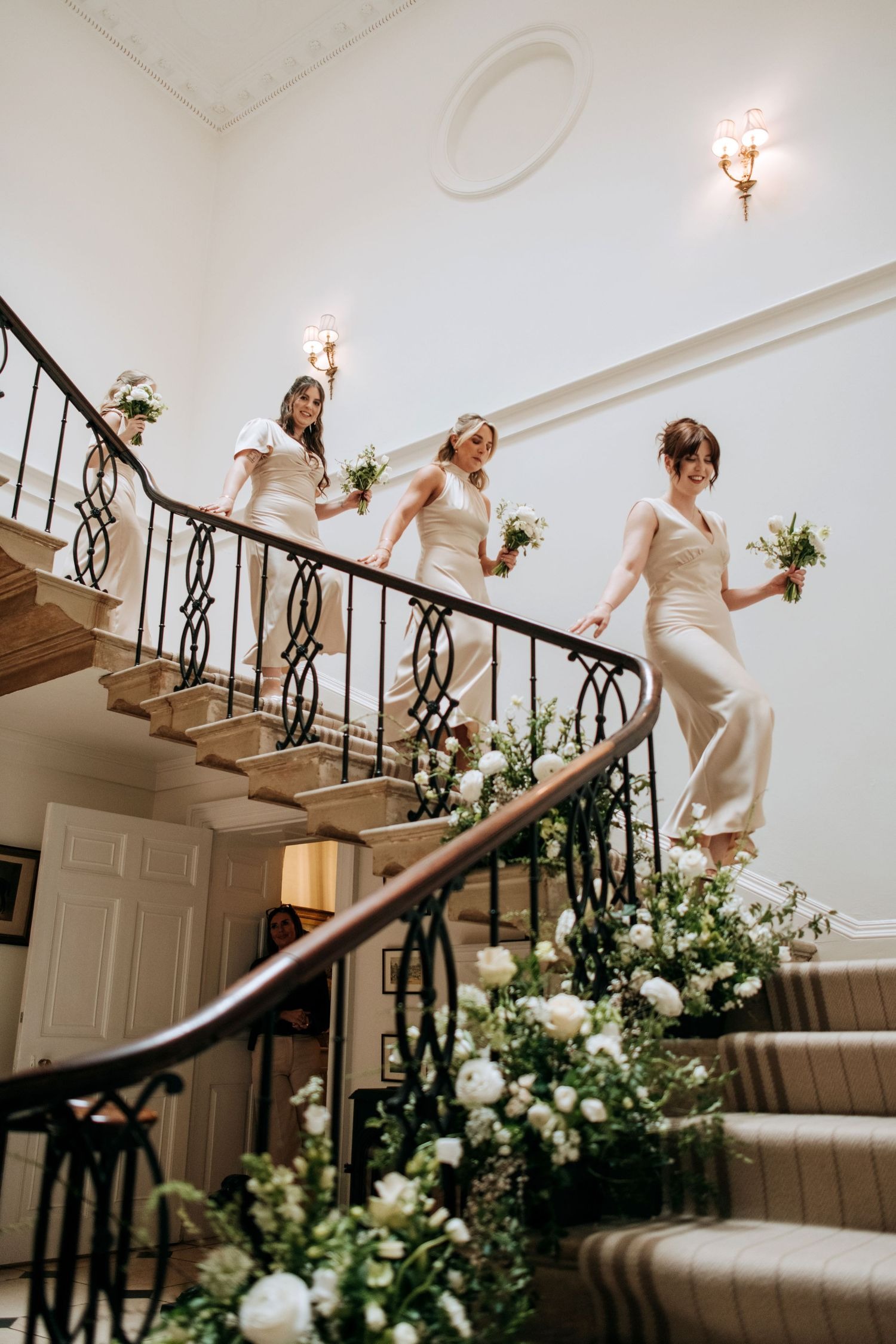 Bride descending staircase at Lincolnshire wedding venue