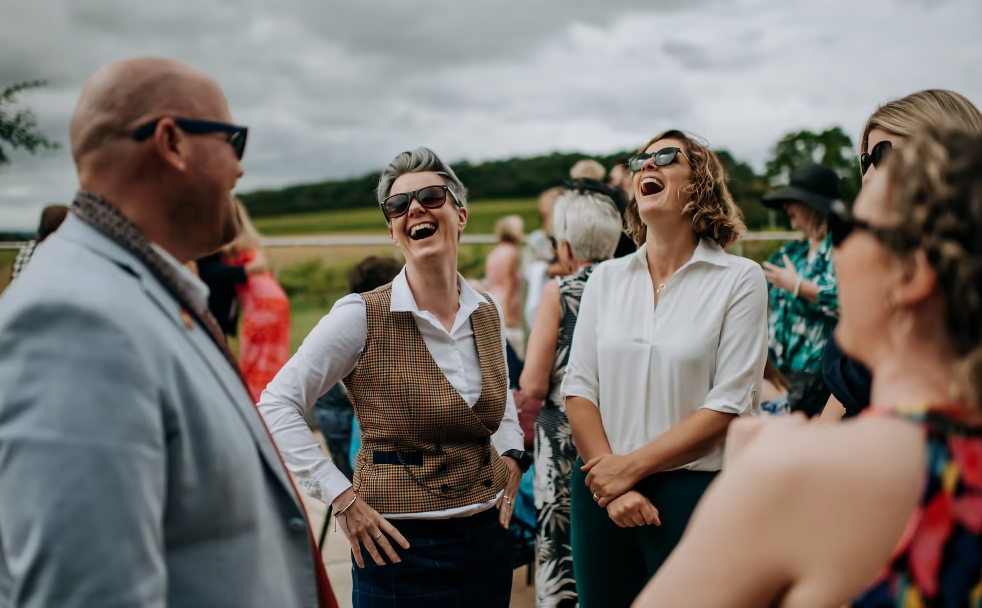 Guests chatting during outdoor wedding ceremony at Little Wold Vineyard