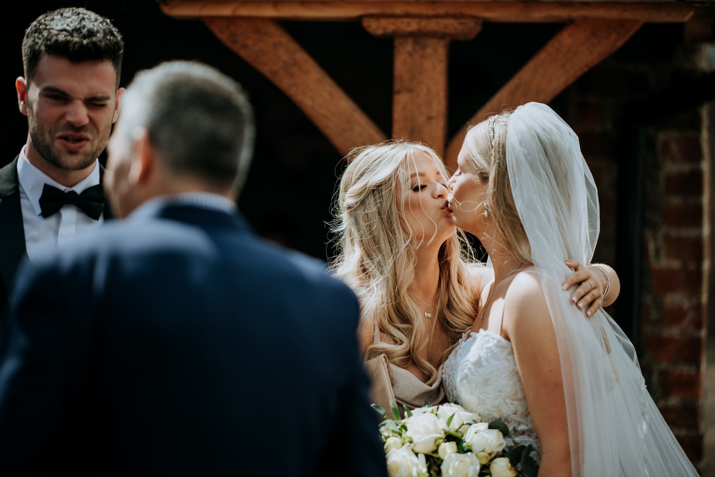 Guests celebrating during wedding reception at Wootton Hall