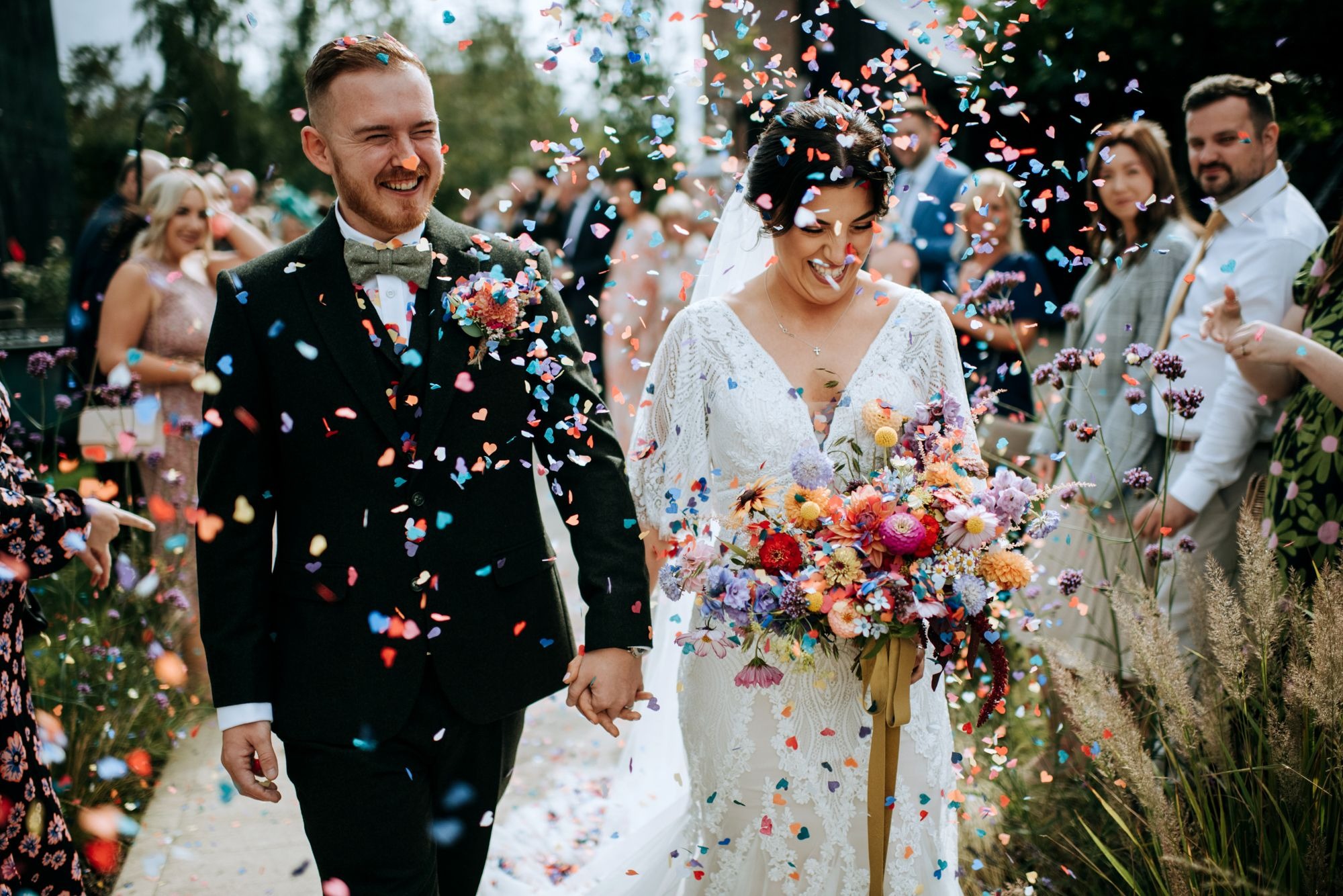 Bride and groom confetti exit at Riverlands wedding venue