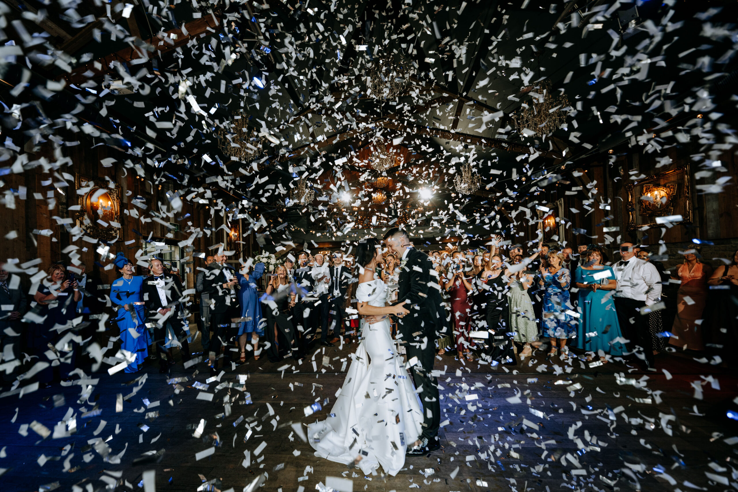 Bride and groom surrounded by confetti at Wharfedale Grange