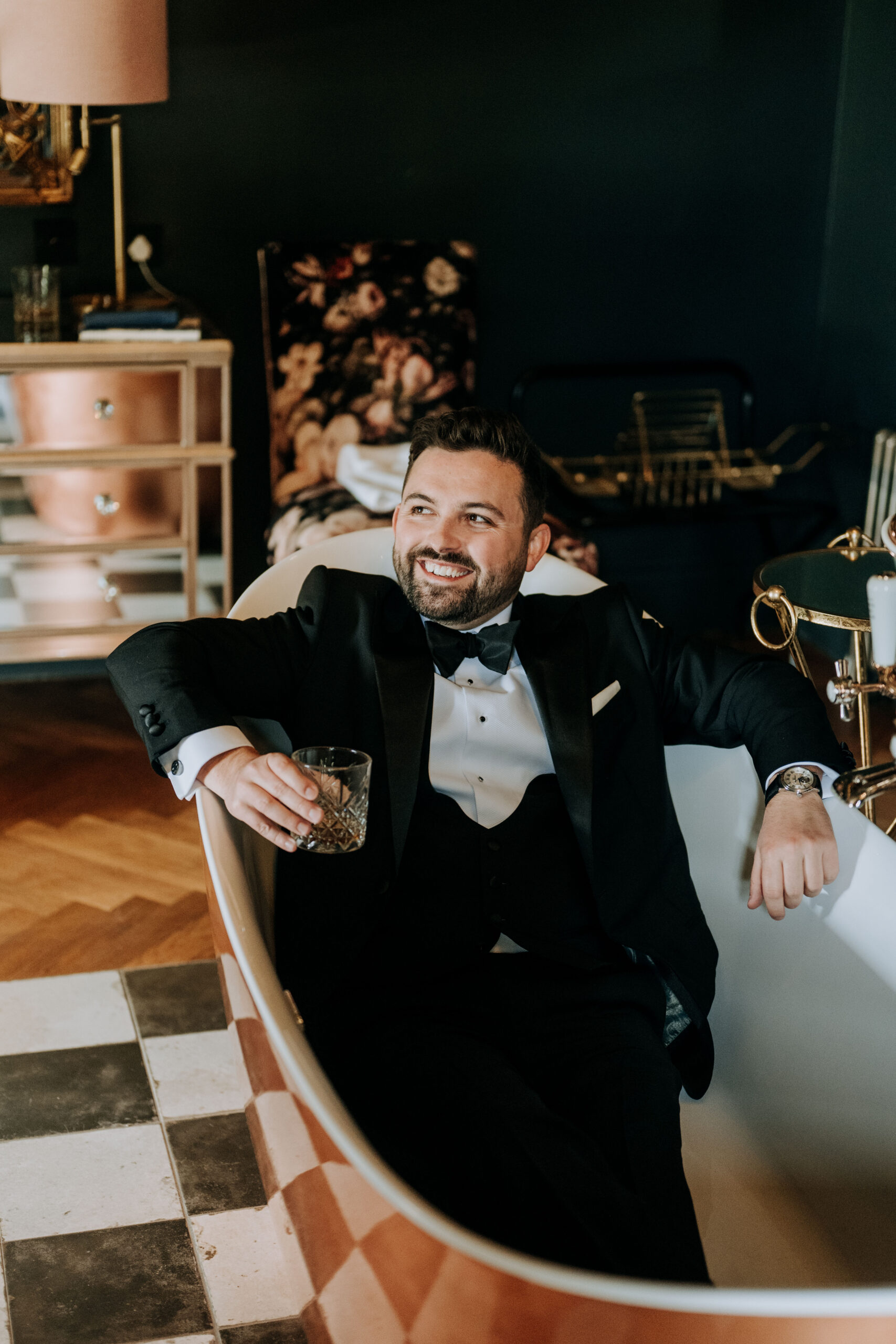 Groom Joking in the Bath Tub Dressed before his wedding at Wharfdale Grange