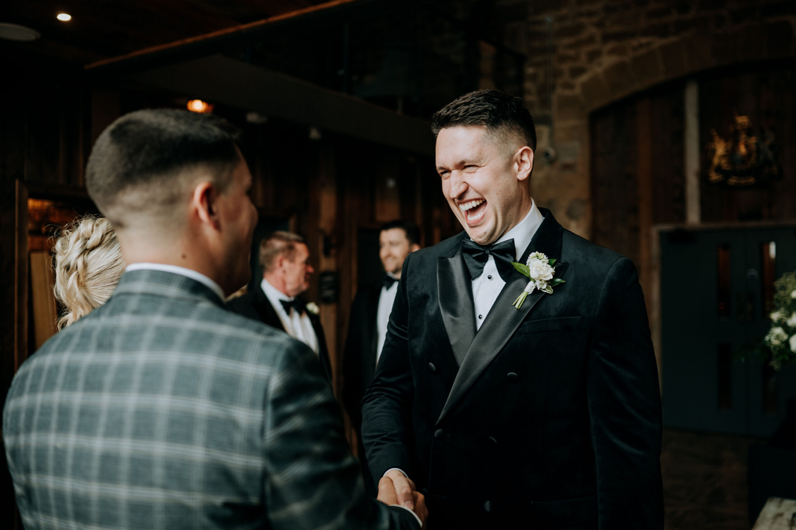 Groom greeting guests before the wedding ceremony at Wharfedale Grange