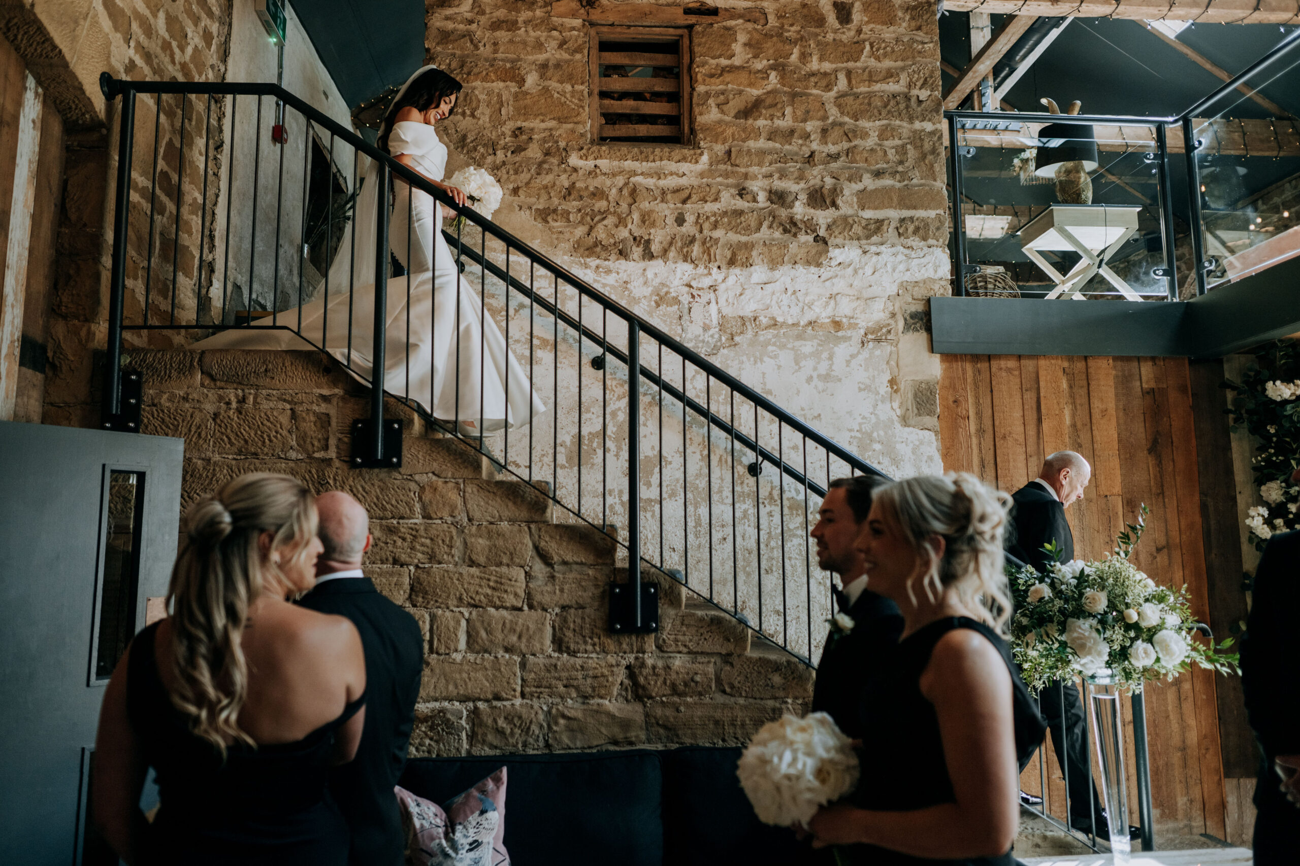 Bride walking through the barn at Wharfedale Grange