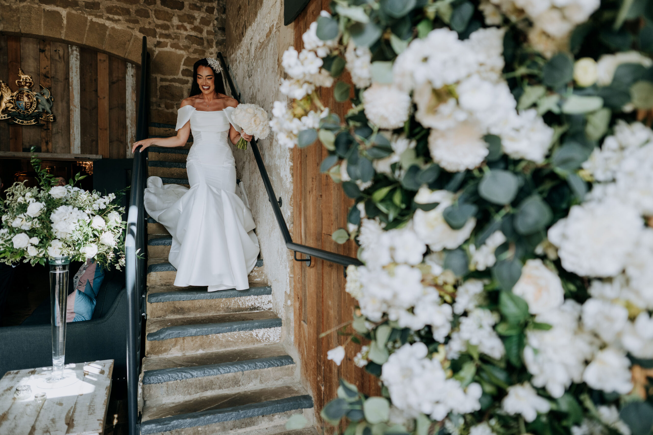 Wedding flowers at Wharfedale Grange with Bride Walking Down the Stairs